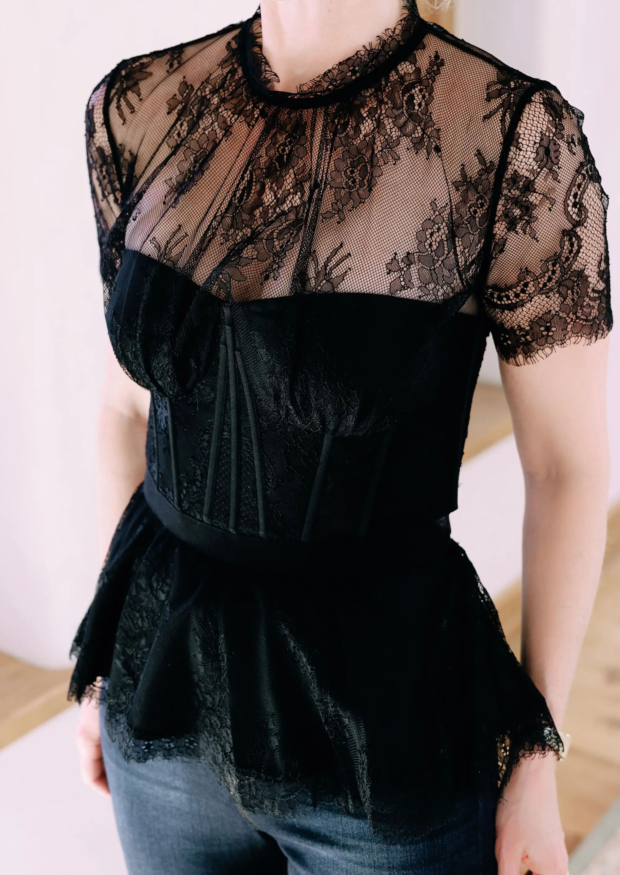 Holiday Outfits With Jeans, Erin Busbee of Busbee Style wearing a black lace corset top by Jonathan Simkhai, L'Agence dark wash skinny jeans, and black Jimmy Choo Romy pumps from Nordstrom in Telluride, Colorado