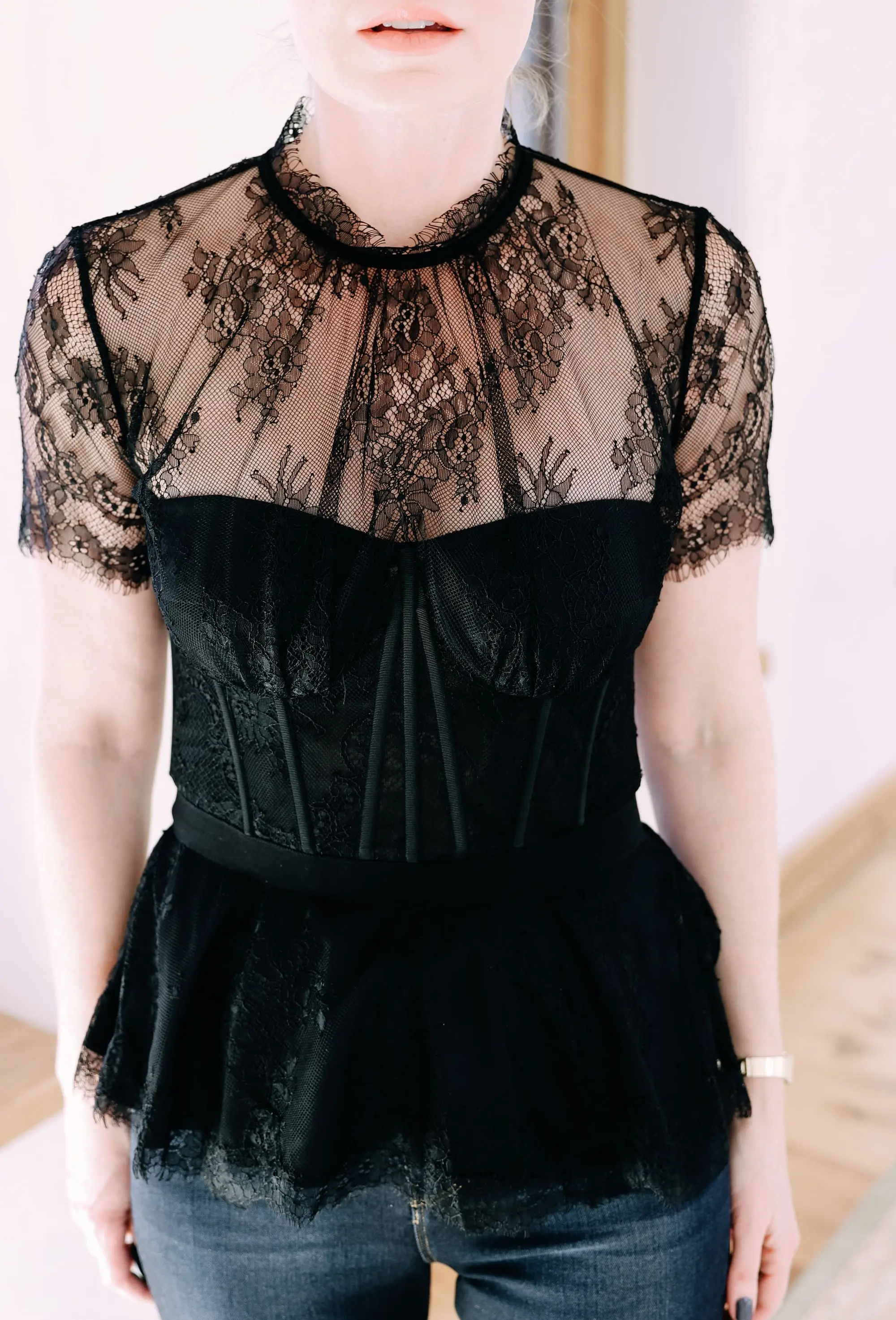 Holiday Outfits With Jeans, Erin Busbee of Busbee Style wearing a black lace corset top by Jonathan Simkhai, L'Agence dark wash skinny jeans, and black Jimmy Choo Romy pumps from Nordstrom in Telluride, Colorado
