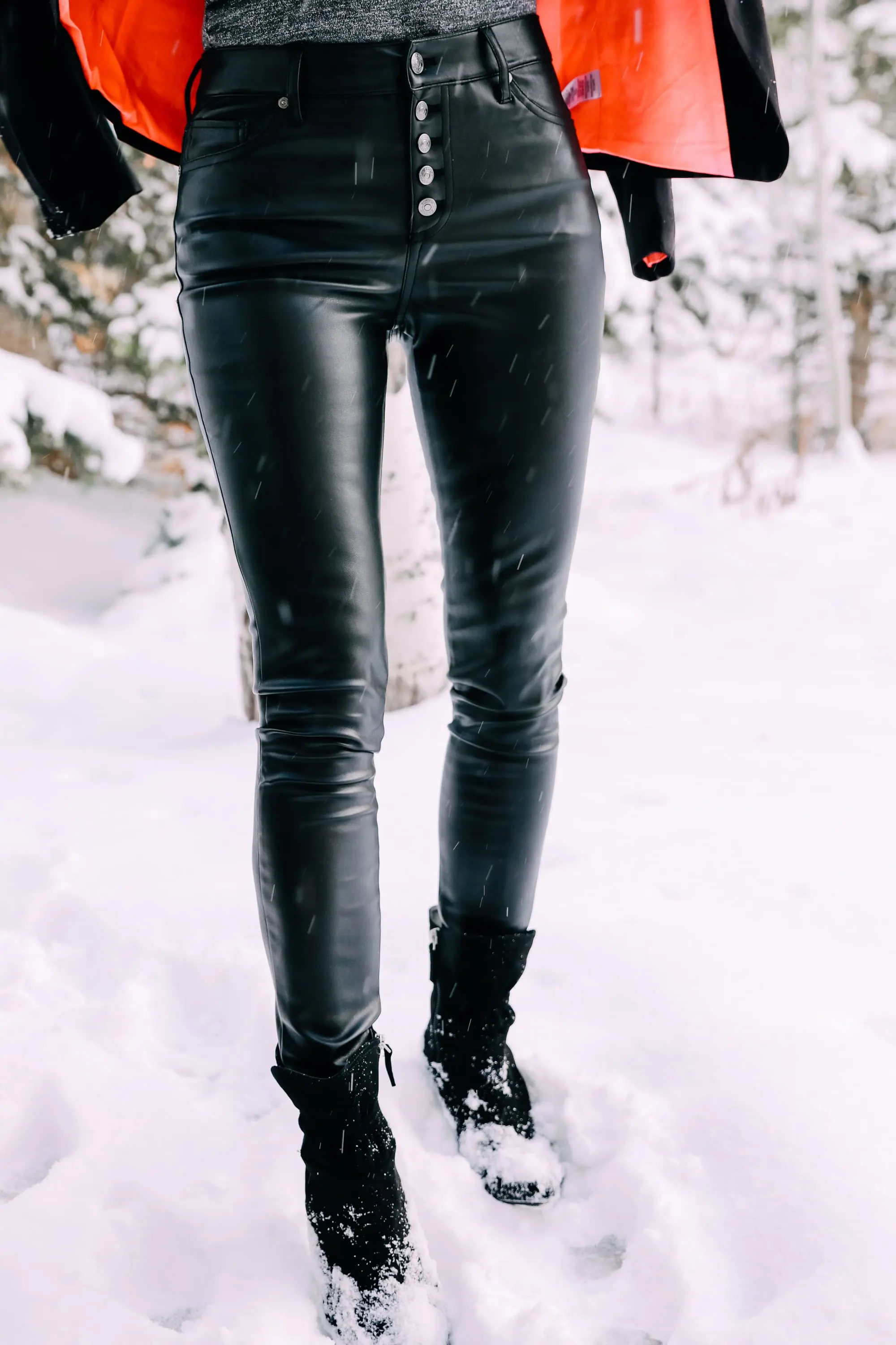 Holiday Party Outfits, Erin Busbee of Busbee Style wearing a black double breasted crepe blazer by Scoop over a metallic wrap style bodysuit but Sofia Vergara with black faux leather high rise skinny jeans by Scoop and black stiletto booties by Scoop in the snow in Telluride, Colorado