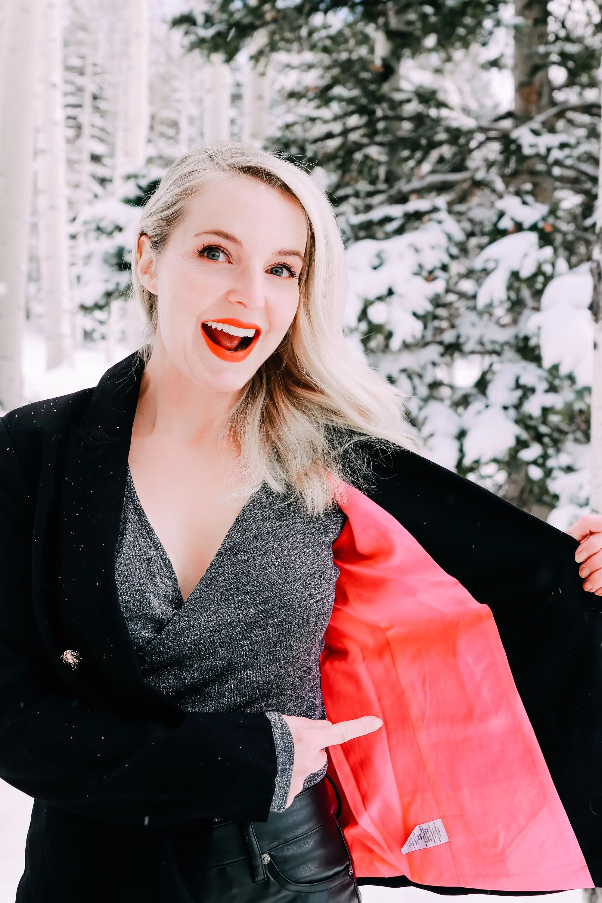 Holiday Party Outfits, Erin Busbee of Busbee Style wearing a black double breasted crepe blazer by Scoop over a metallic wrap style bodysuit but Sofia Vergara with black faux leather high rise skinny jeans by Scoop and black stiletto booties by Scoop in the snow in Telluride, Colorado