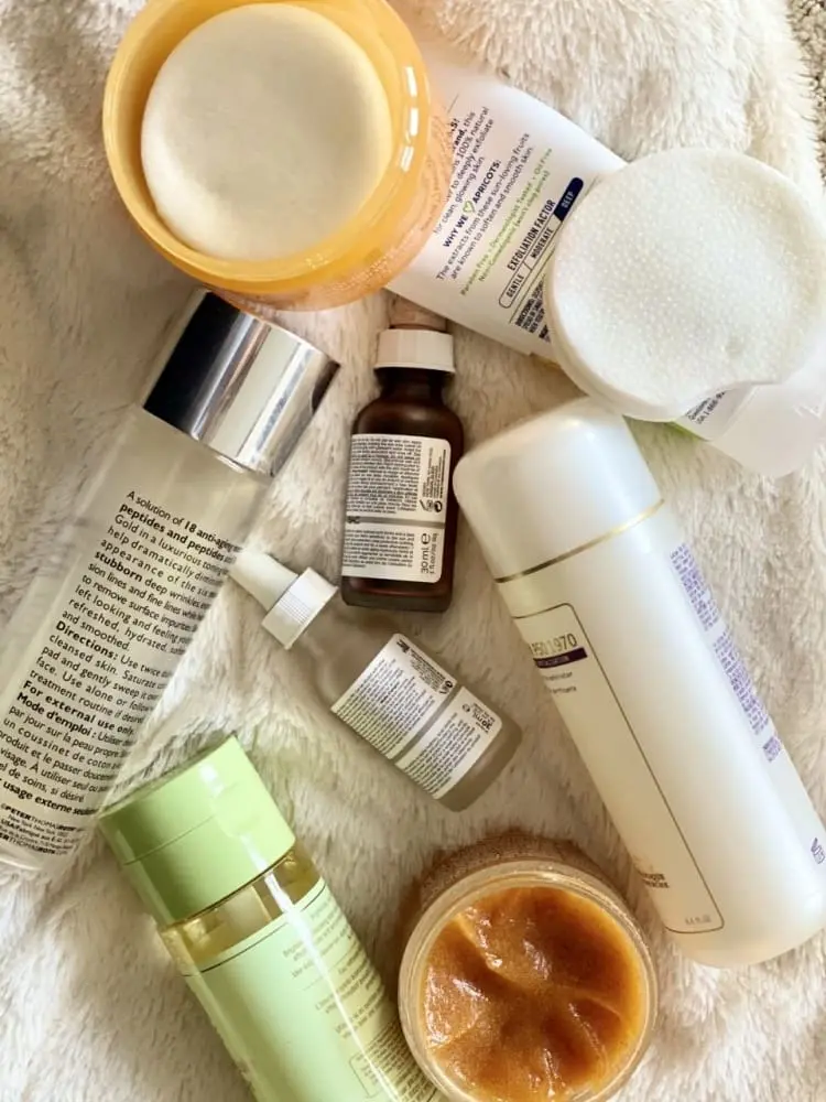 Best beauty products of 2020_various products flat lay on white carpet