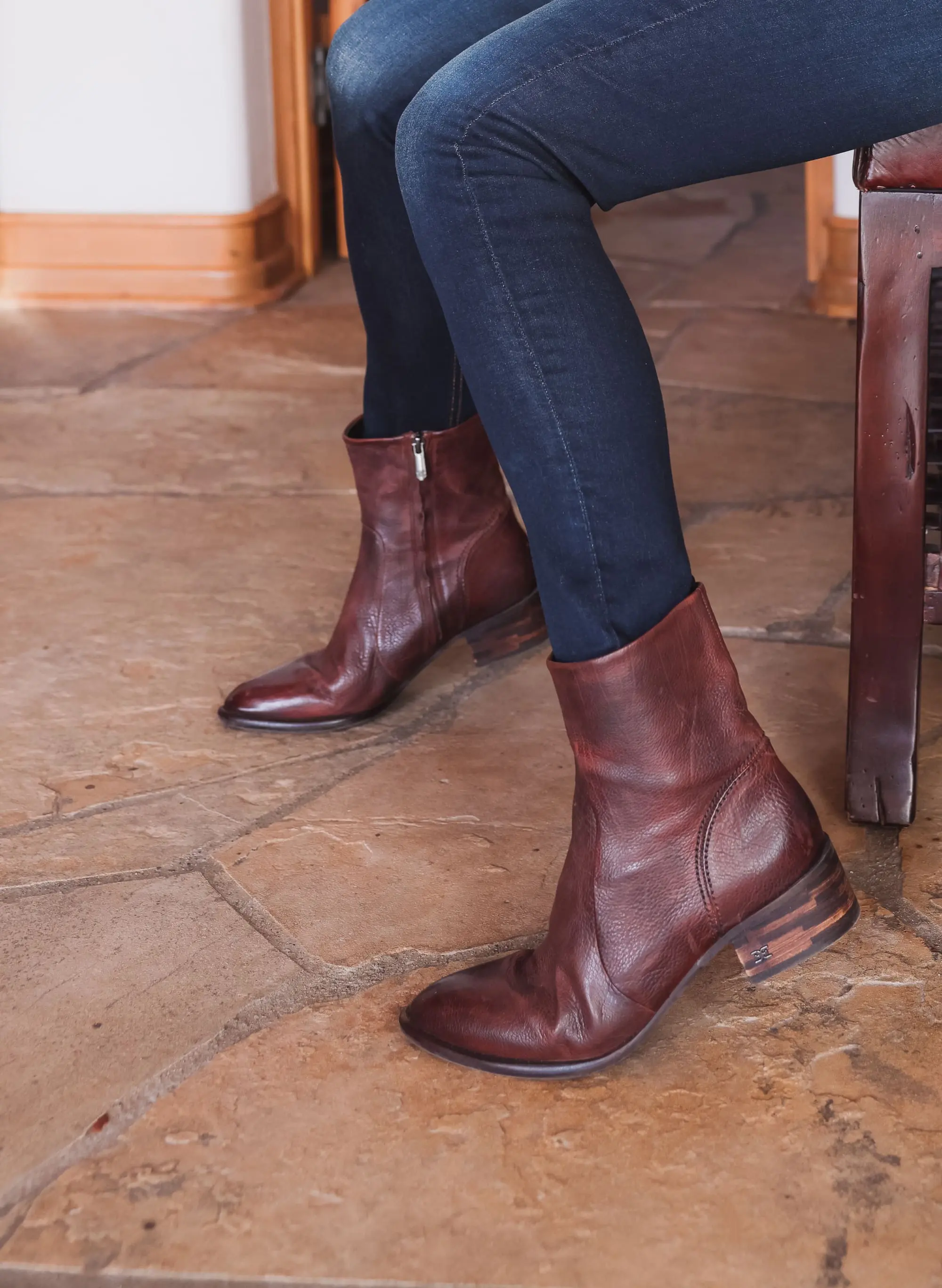Best brown booties, Erin Busbee of Busbee wearing an ASTR the Label sculptural sleeve sweater with rag & bone skinny jeans and brown sam edelman hilary booties from Nordstrom in Telluride, Colorado