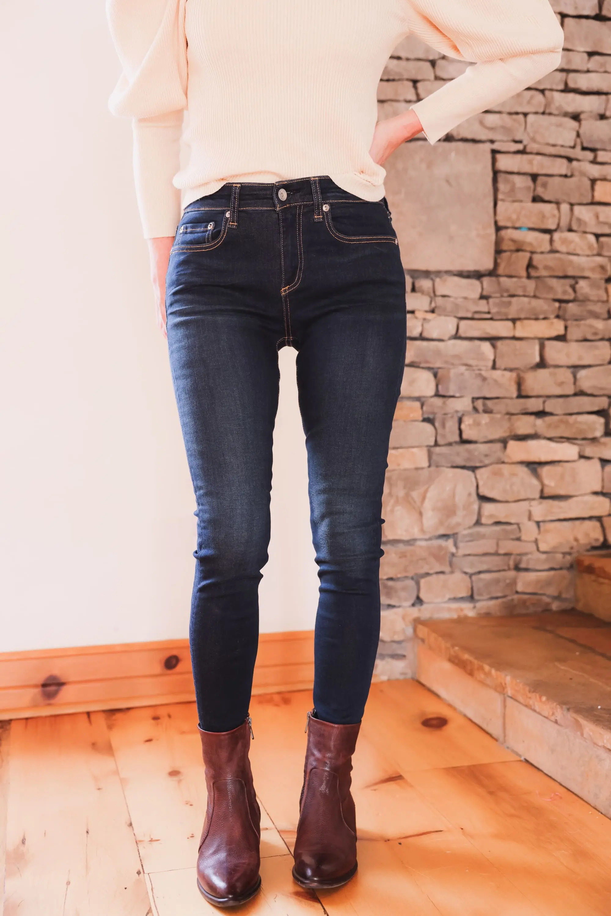 Best brown booties, Erin Busbee of Busbee wearing an ASTR the Label sculptural sleeve sweater with rag & bone skinny jeans and brown sam edelman hilary booties from Nordstrom in Telluride, Colorado