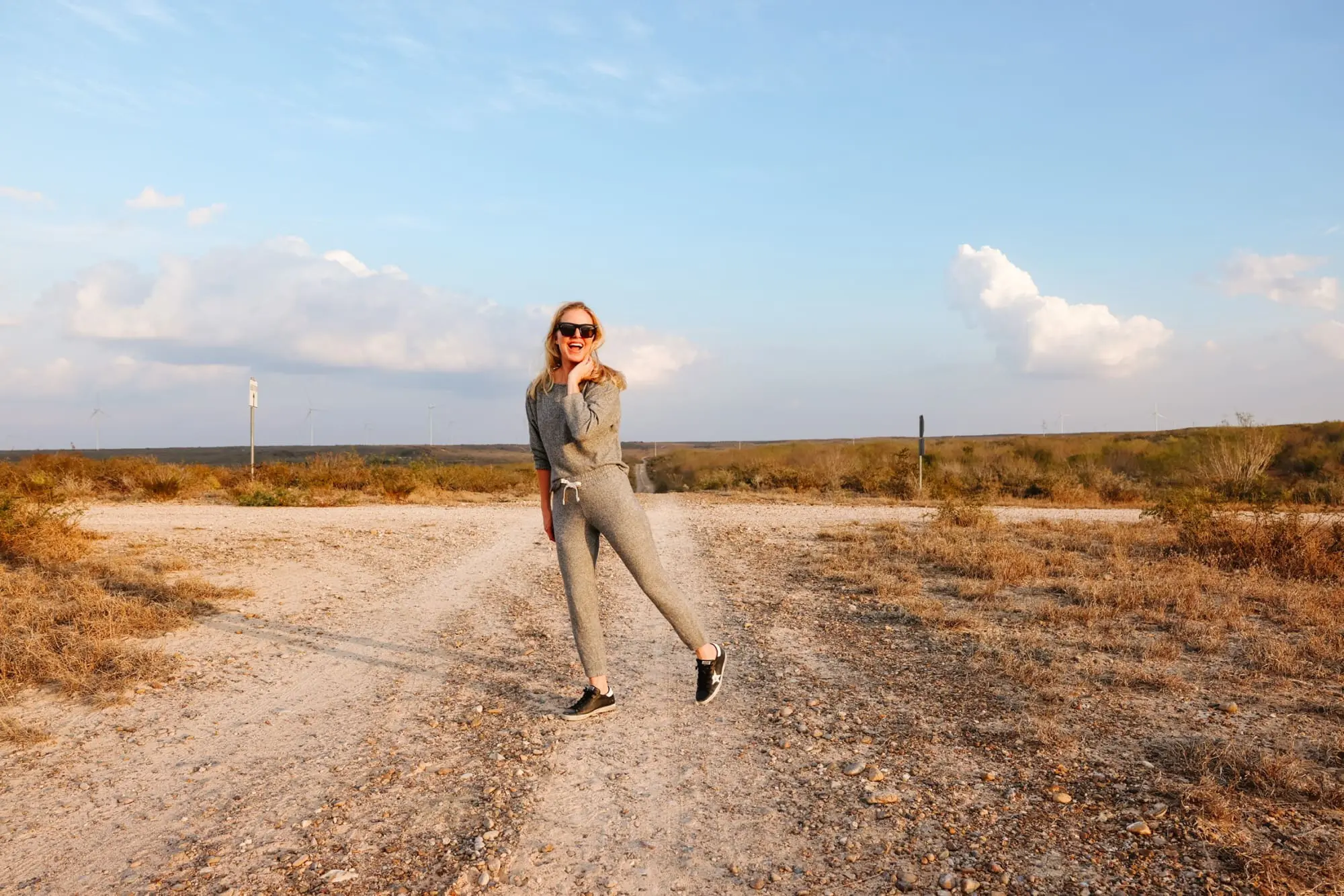 Cozy Loungewear, Erin Busbee of Busbee wearing a gray thermal sweatshirt by Monrow with matching gray thermal joggers by Monrow with black Golden Goose sneakers in South Texas