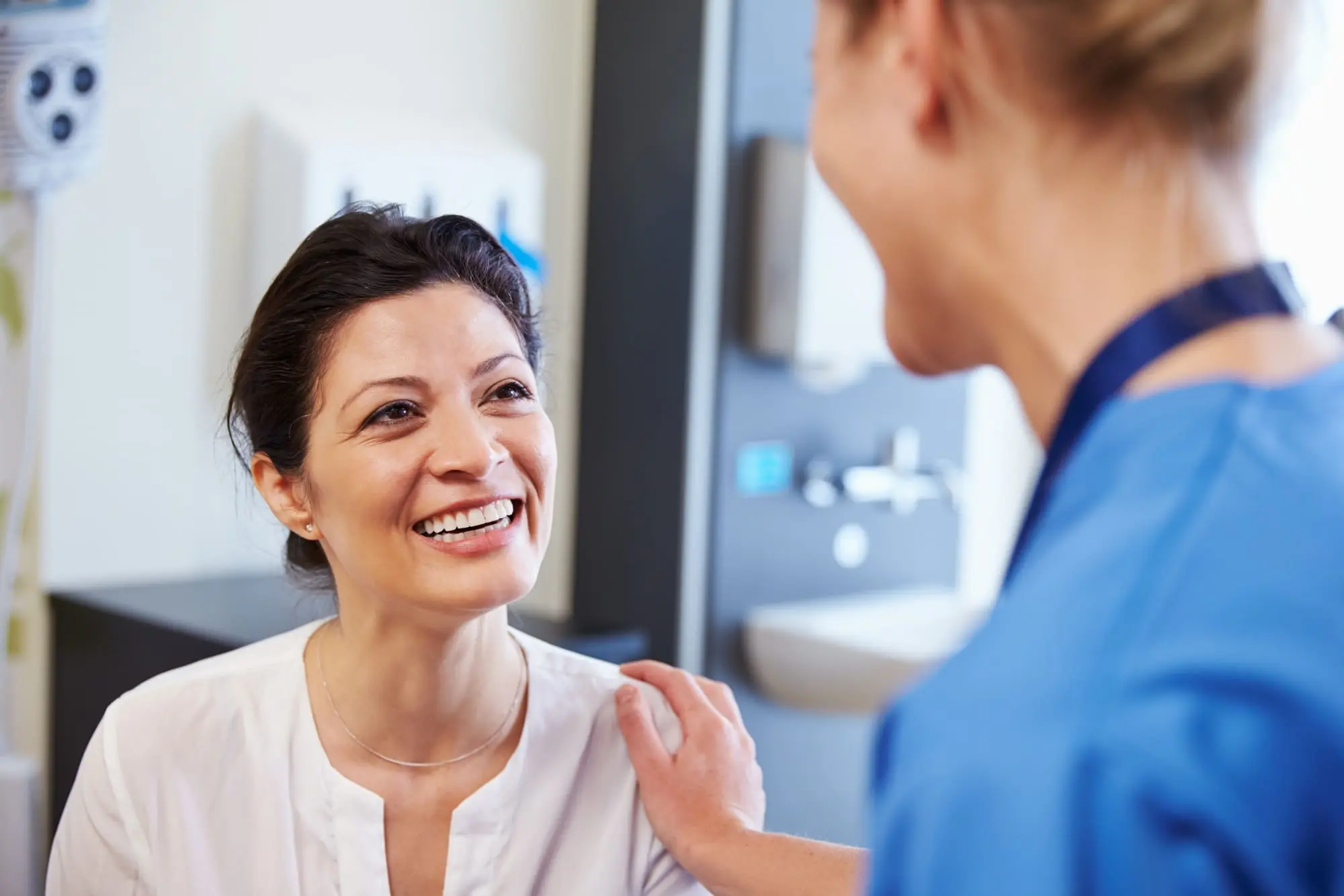 better sex after menopause, Middle aged woman talking with her doctor
