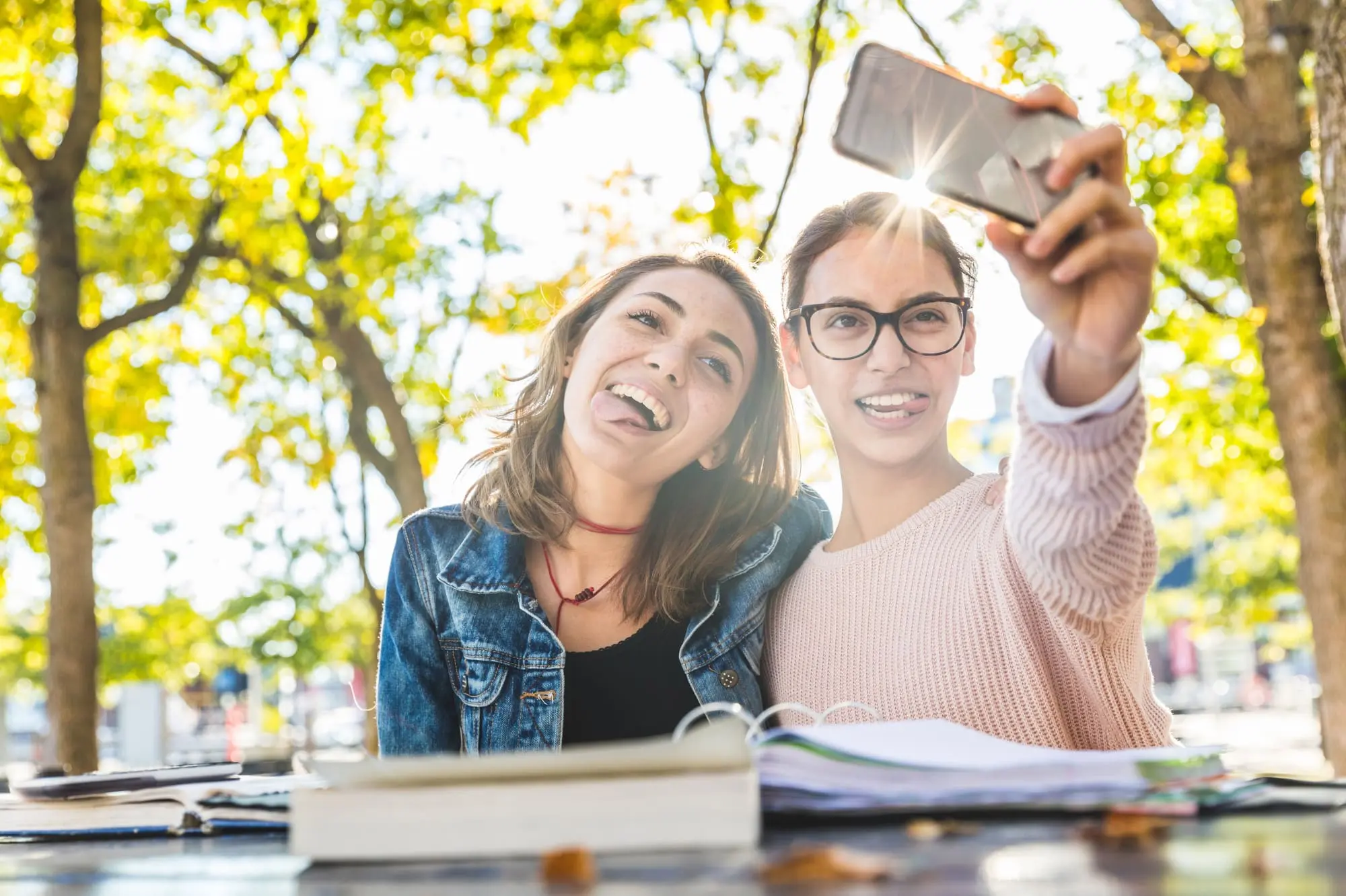 budget for when you have teens, two girlfriends taking a selfie outdoors making silly faces