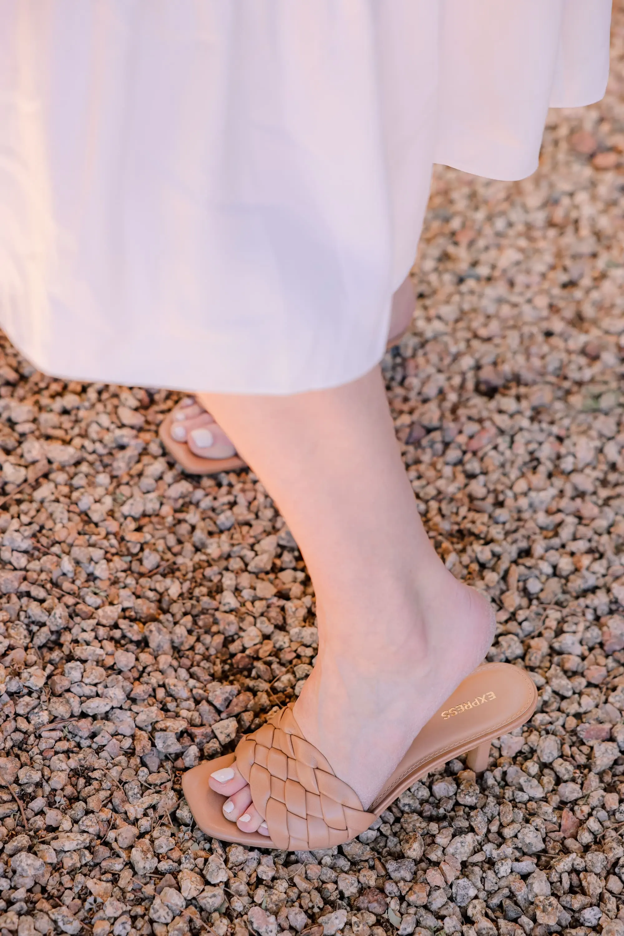 spring shoes, shoe trends spring 2021, best spring shoes, spring shoe styles, shoes for spring, summer shoes, summer sandals, summer shoes list, erin busbee, express tan quilted sandals, white bottega veneta cassette bag, amanda uprichard white midi dress