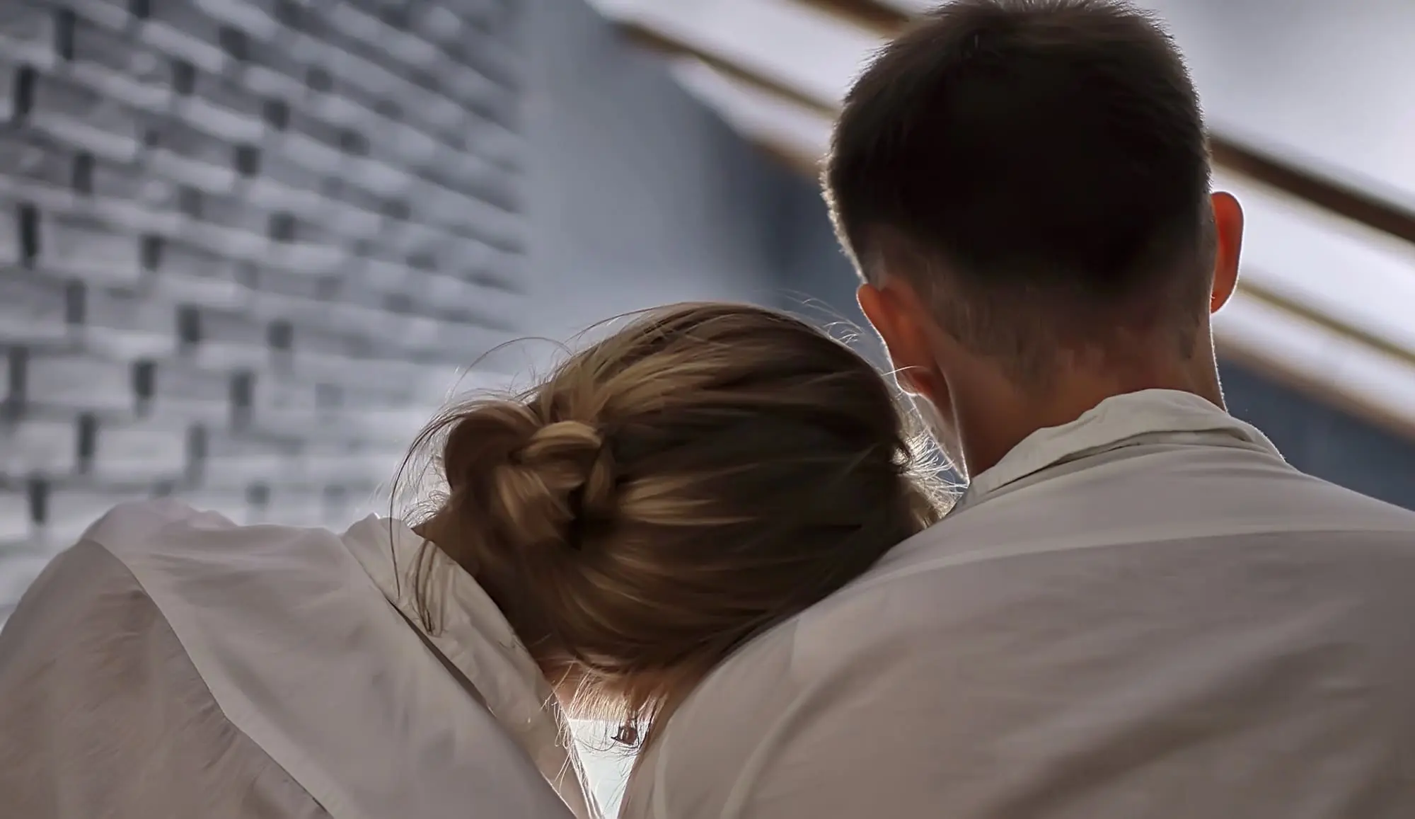 fighting fairly in your relationship, woman leaning her head on her partner’s shoulder, support