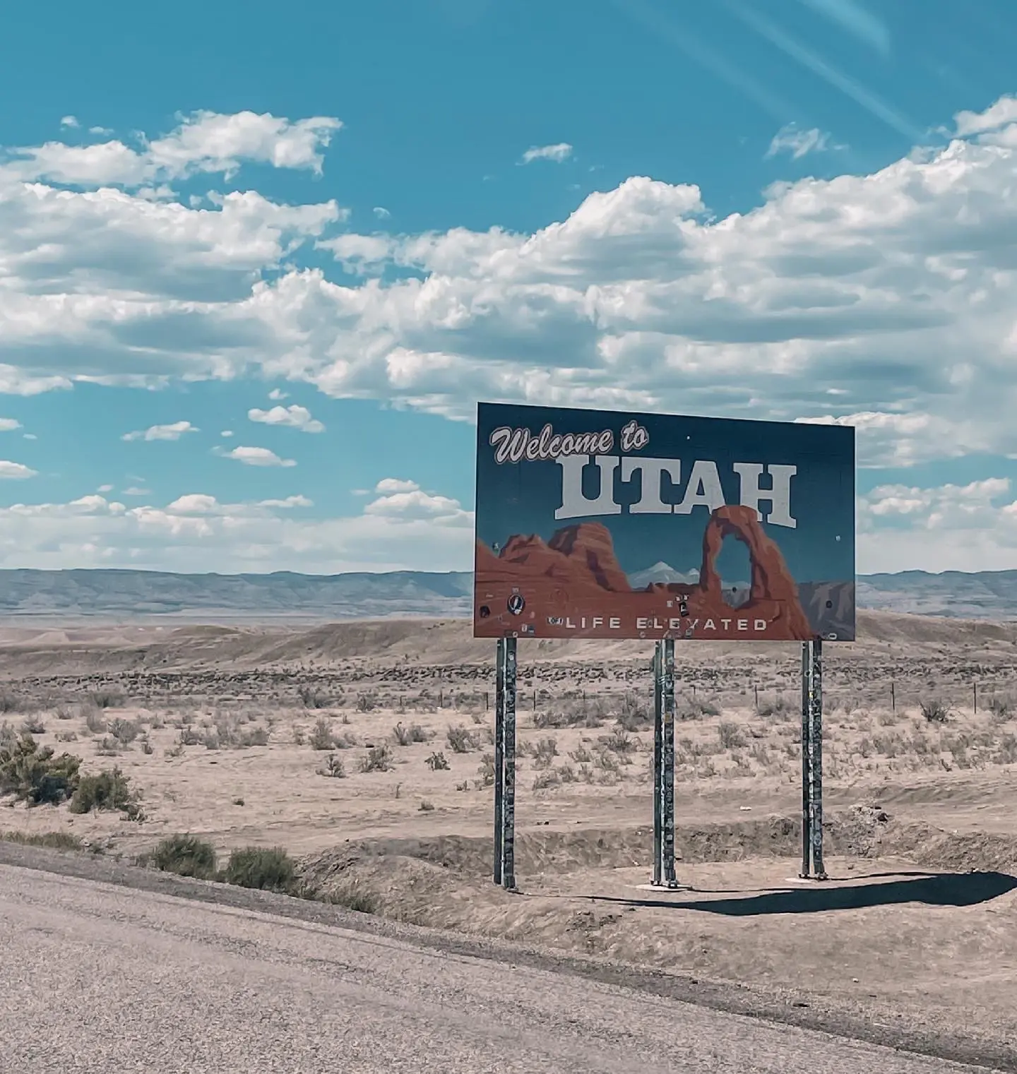 where to stop on a cross-country road trip, best places to stop on a cross country road trip, cross country road trip, west coast to east coast road trip, erin busbee, utah state line, park city utah