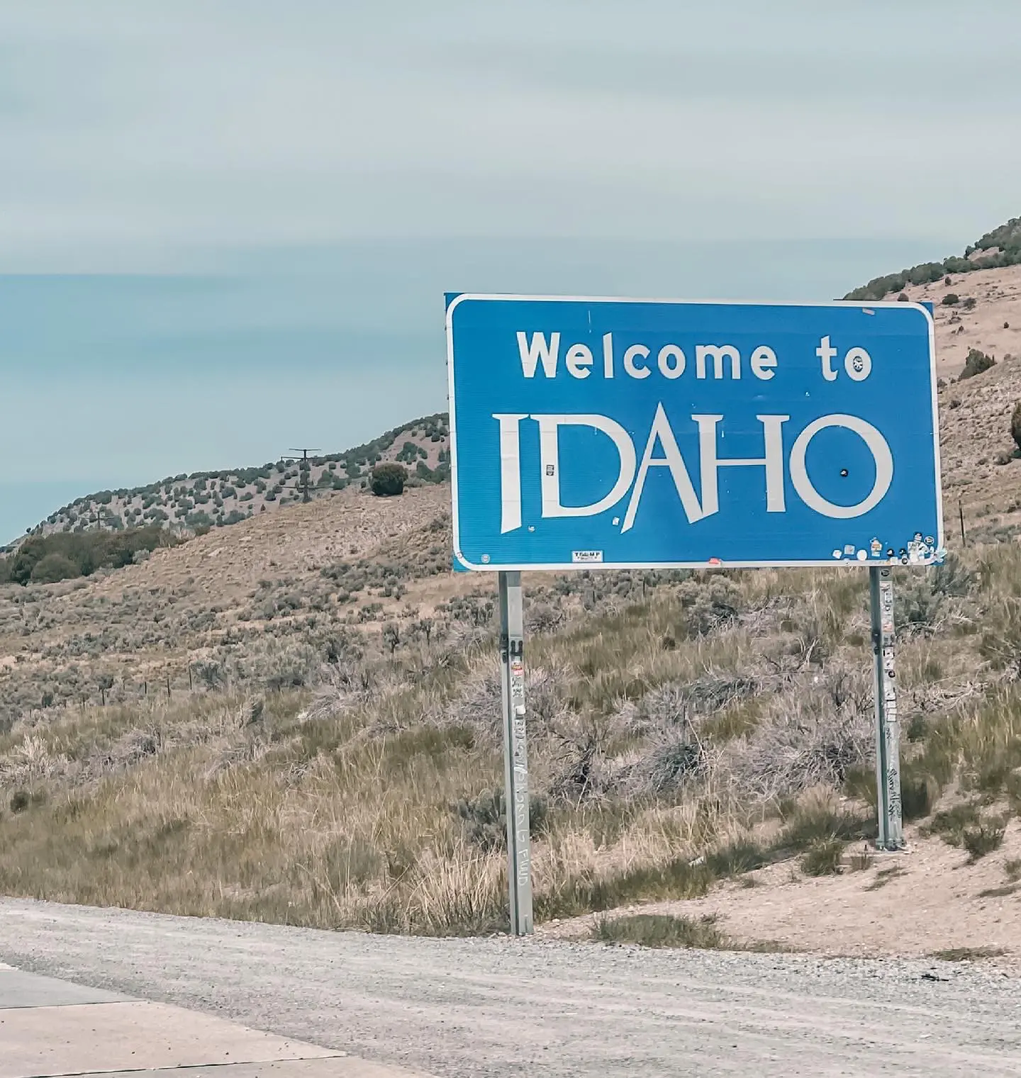 where to stop on a cross-country road trip, best places to stop on a cross country road trip, cross country road trip, west coast to east coast road trip, erin busbee, traveling with kids, how to travel with kids, how to travel with a dog, cross country road trip with kids, idaho state line