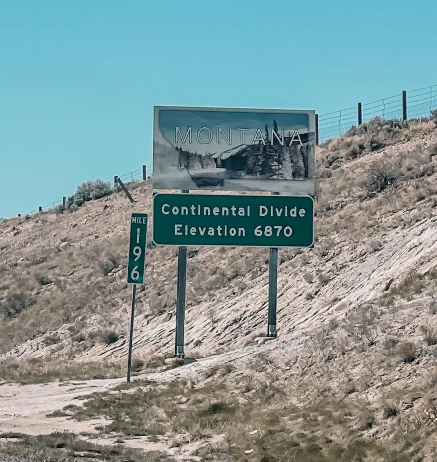 where to stop on a cross-country road trip, best places to stop on a cross country road trip, cross country road trip, west coast to east coast road trip, erin busbee, traveling with kids, how to travel with kids, how to travel with a dog, cross country road trip with kids, montana state line