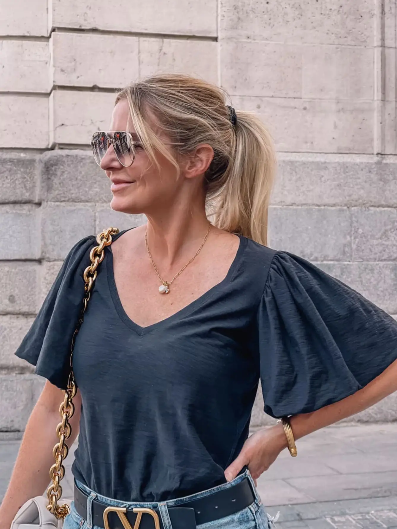 move to spain, move to madrid, why move to spain, where to move in spain, moving to spain, how to move to spain, where to live in spain, Erin Busbee, black nation ltd tee with moussy vintage denim shorts and golden good sneakers