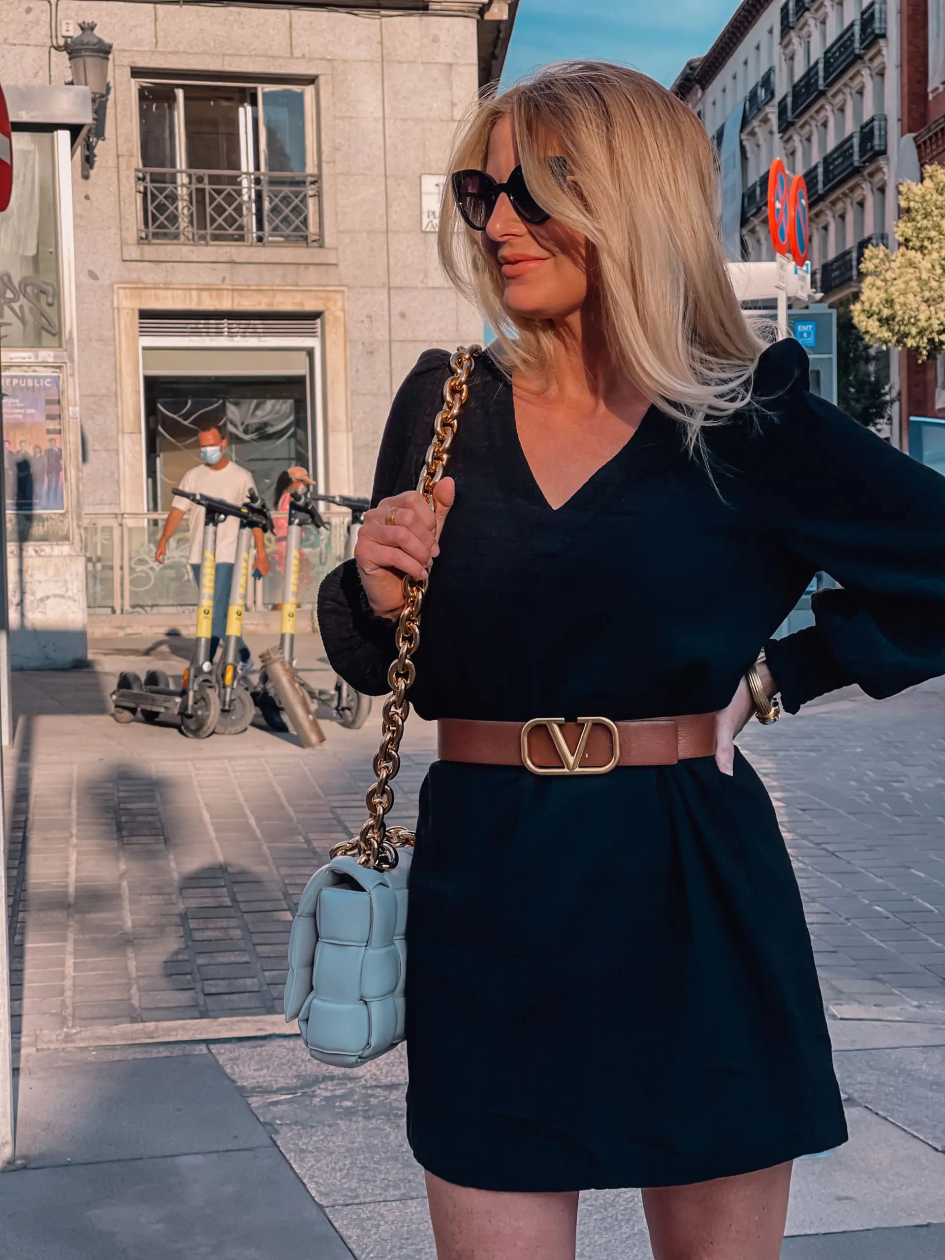 what to wear in spain, how to dress in spain, madrid, how to dress in madrid, what to wear in madrid, how to pack for a trip to spain, trip to spain, packing for spain, erin busbee, bb dakota black long sleeve dress, valentino reversible belt, bottega veneta chain cassette bag, quay cat eye sunglasses