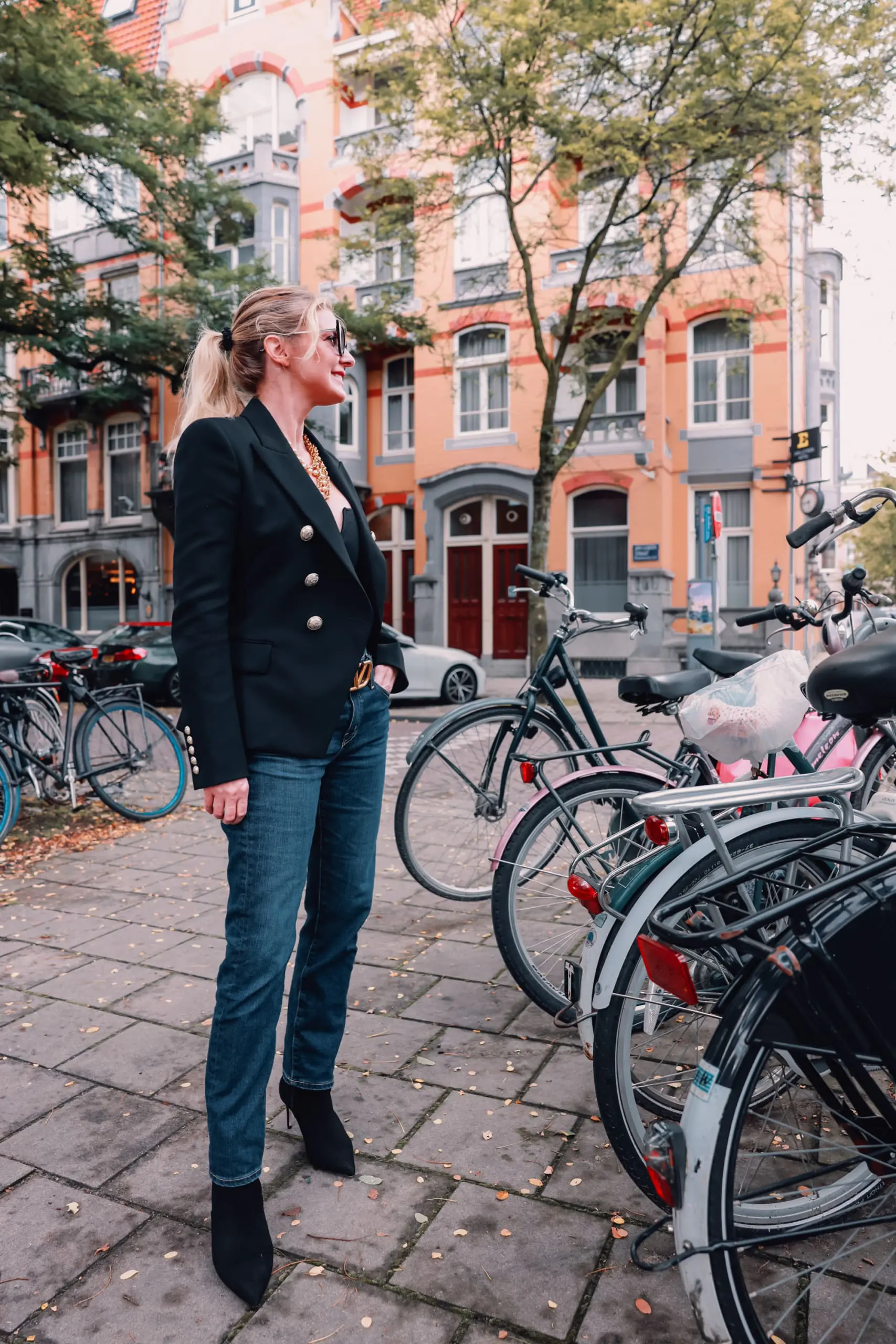 casual date night outfit, what to wear date night, how to dress for date night, date night look, casual date night, easy date night outfit, erin bsubee, balmain blazer, ag ex-boyfriend jeans, schutz black bette booties, valentino belt, lulu notch neck bodysuit, amsterdam, netherlands