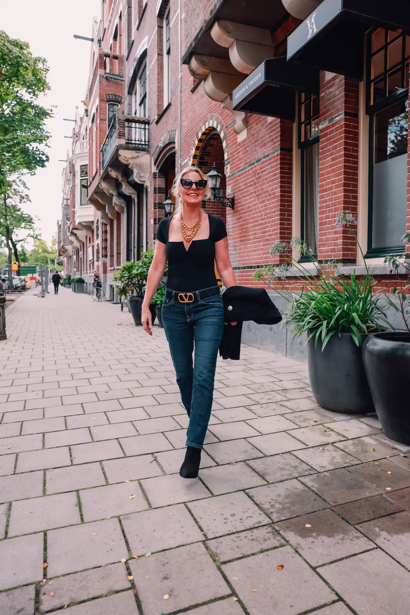 casual date night outfit, what to wear date night, how to dress for date night, date night look, casual date night, easy date night outfit, erin bsubee, balmain blazer, ag ex-boyfriend jeans, schutz black bette booties, valentino belt, lulu notch neck bodysuit, amsterdam, netherlands