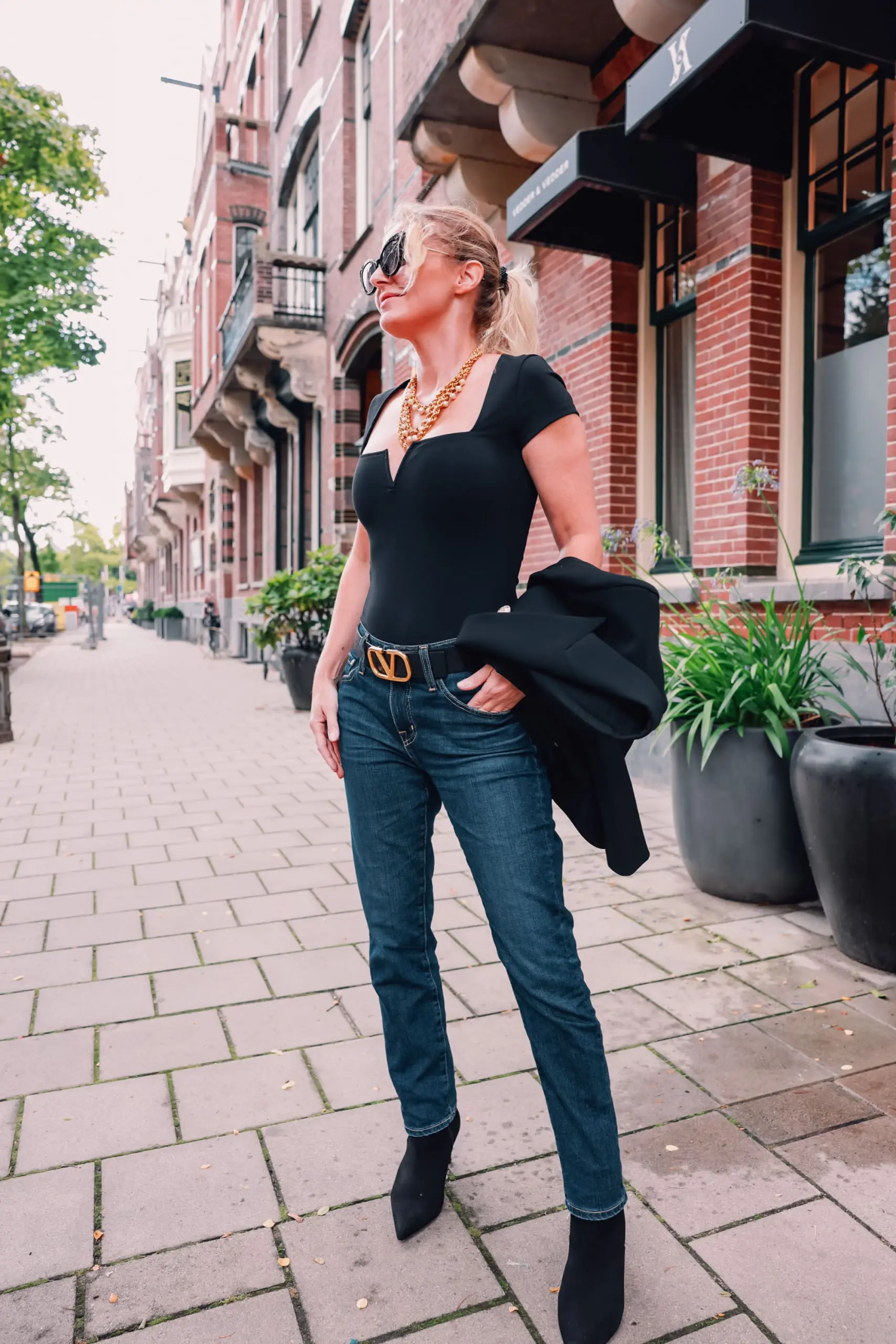 casual date night outfit, what to wear date night, how to dress for date night, date night look, casual date night, easy date night outfit, erin bsubee, balmain blazer, ag ex-boyfriend jeans, schutz black bette booties, valentino belt, lulu notch neck bodysuit, amsterdam, netherlands