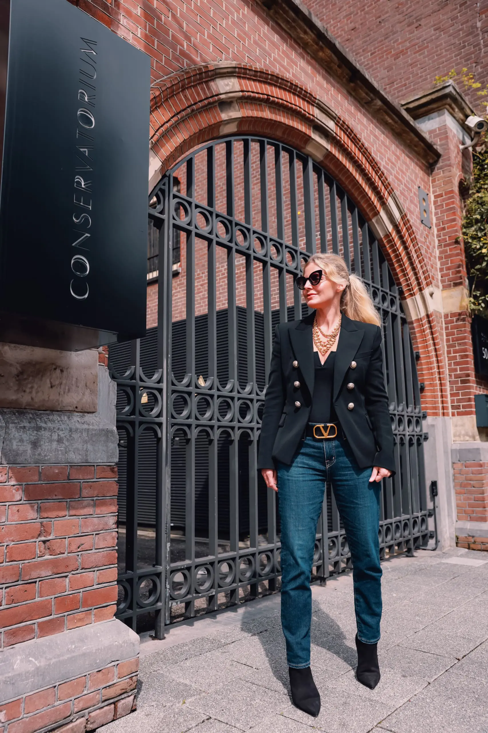 casual date night outfit, what to wear date night, how to dress for date night, date night look, casual date night, easy date night outfit, erin bsubee, balmain blazer, ag ex-boyfriend jeans, schutz black bette booties, valentino belt, lulu notch neck bodysuit, amsterdam, netherlands