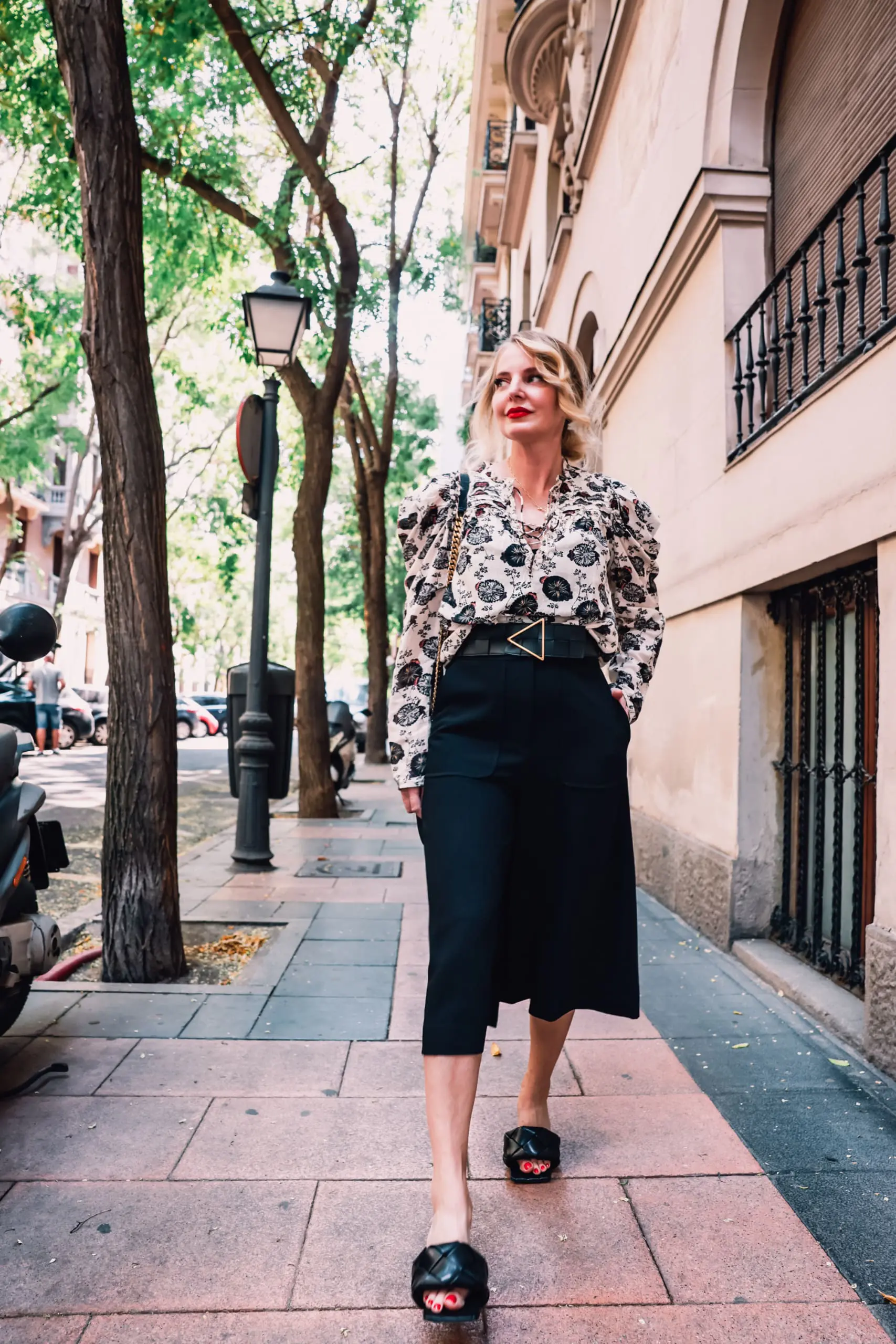 how to wear culottes, why wear culottes, how to style culottes, wear culottes, style culottes, how to wear culottes over 40, styling culottes over 40, erin busbee, see by chloe culottes, bottega veneta lido heels, ulla johnson printed floral blouse, bottega veneta belt, saint laurent leather and suede chevron bag, neiman marcus, madrid, spain