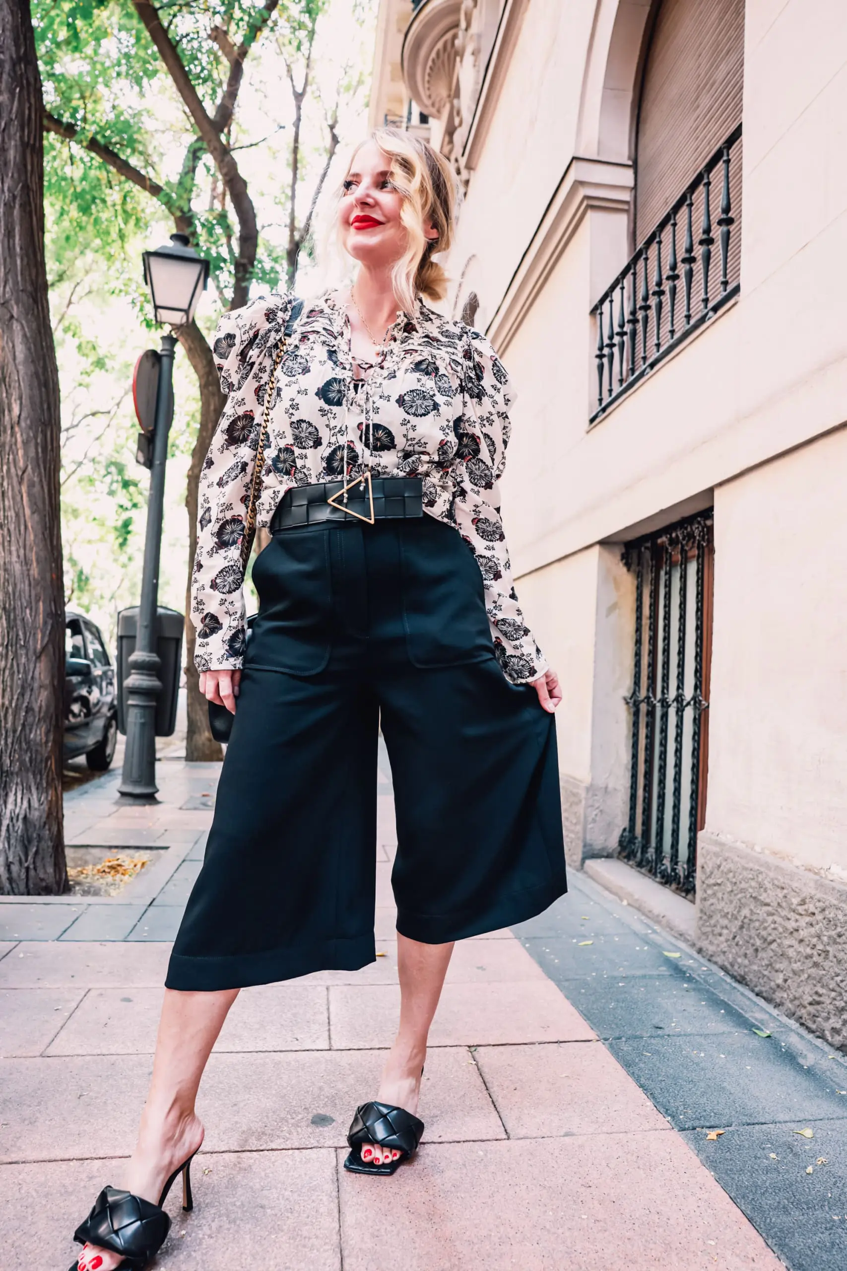 how to wear culottes, why wear culottes, how to style culottes, wear culottes, style culottes, how to wear culottes over 40, styling culottes over 40, erin busbee, see by chloe culottes, bottega veneta lido heels, ulla johnson printed floral blouse, bottega veneta belt, saint laurent leather and suede chevron bag, neiman marcus, madrid, spain