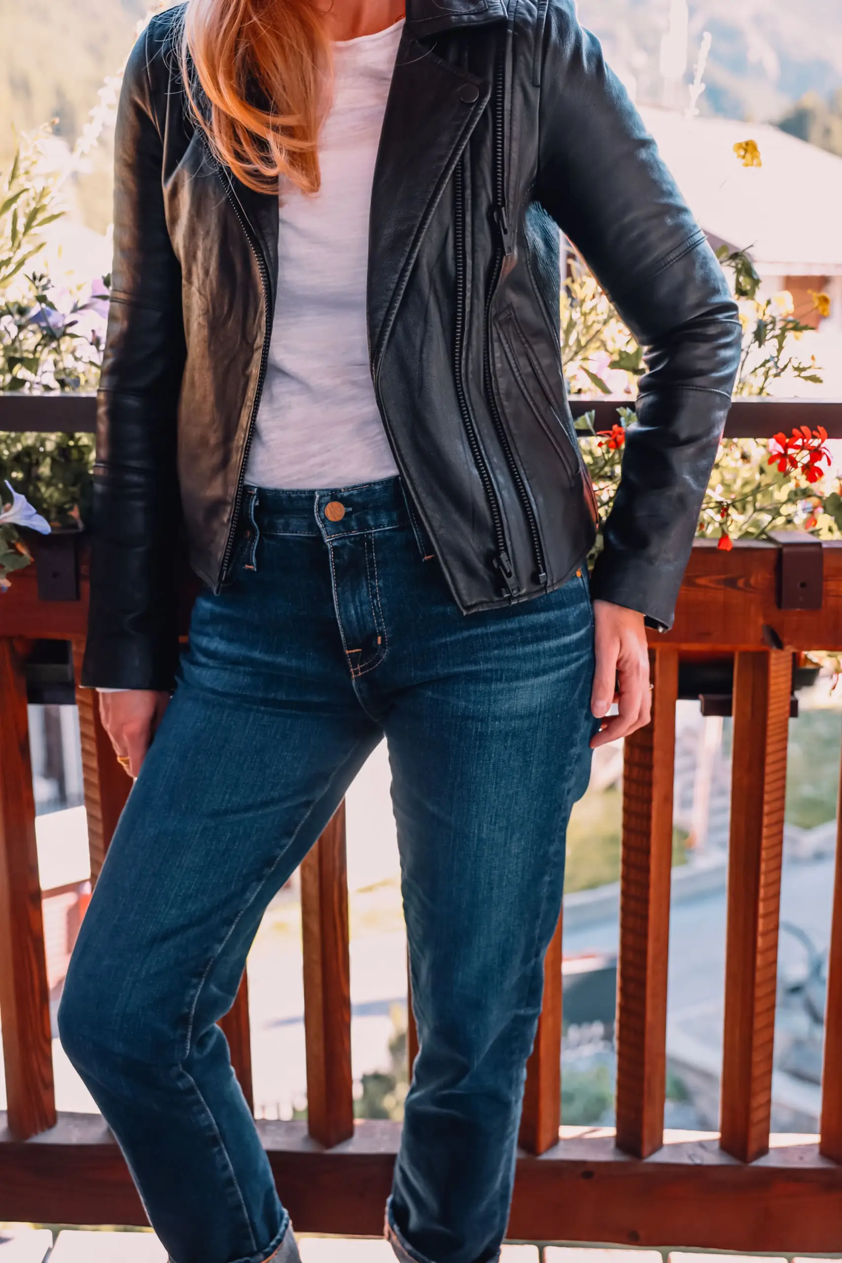 ways to wear a moto jacket, how to wear a moto jacket, moto jackets over 40, how to wear a moto jacket over 40, wearing moto jackets, how to style a moto jacket over 40, erin busbee, black leather moto jacket, free people natasha tee, ag ex-boyfriend relaxed fit jeans, black Paige side zip booties, zermatt switzerland