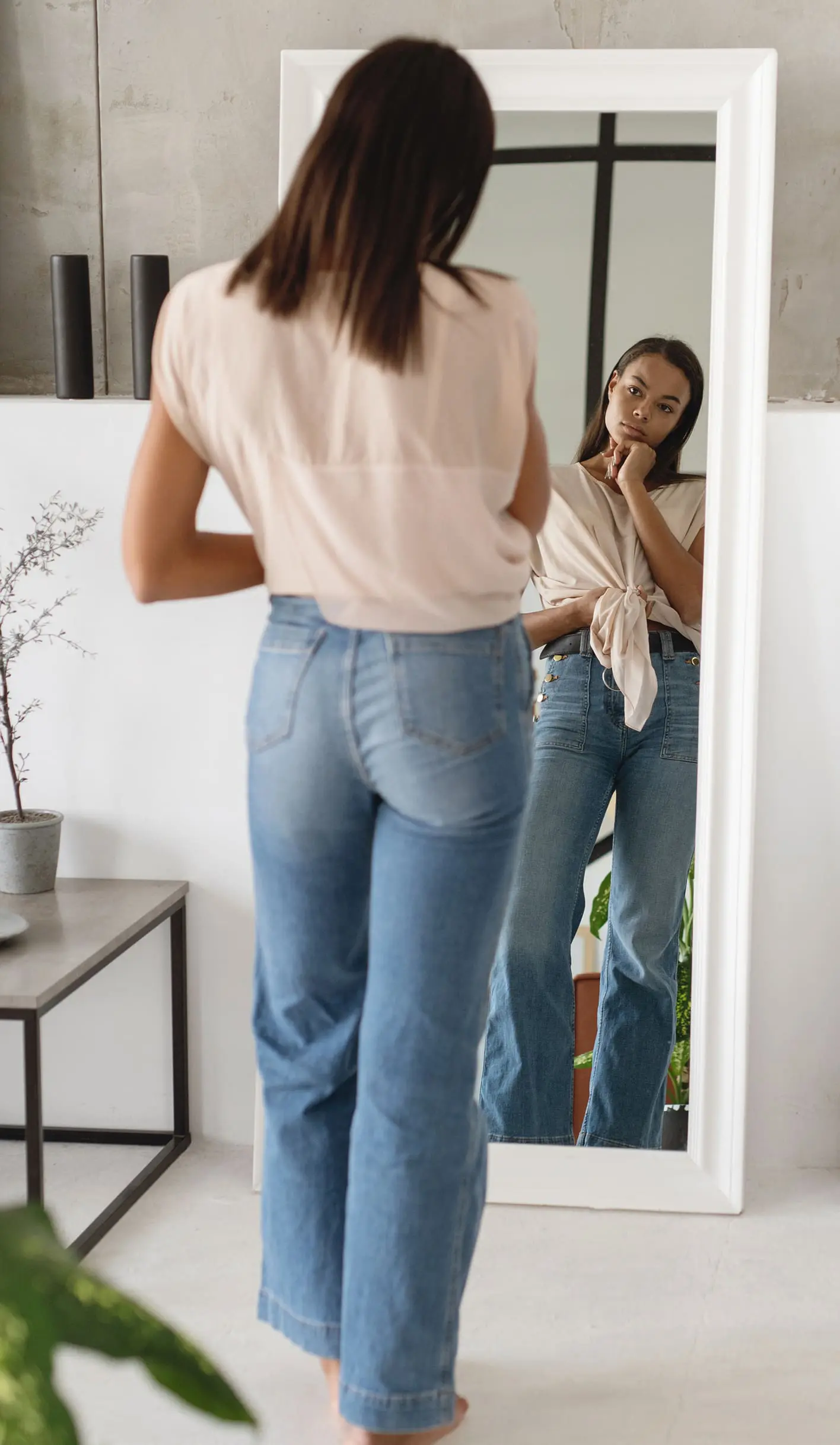 woman looking in the mirror