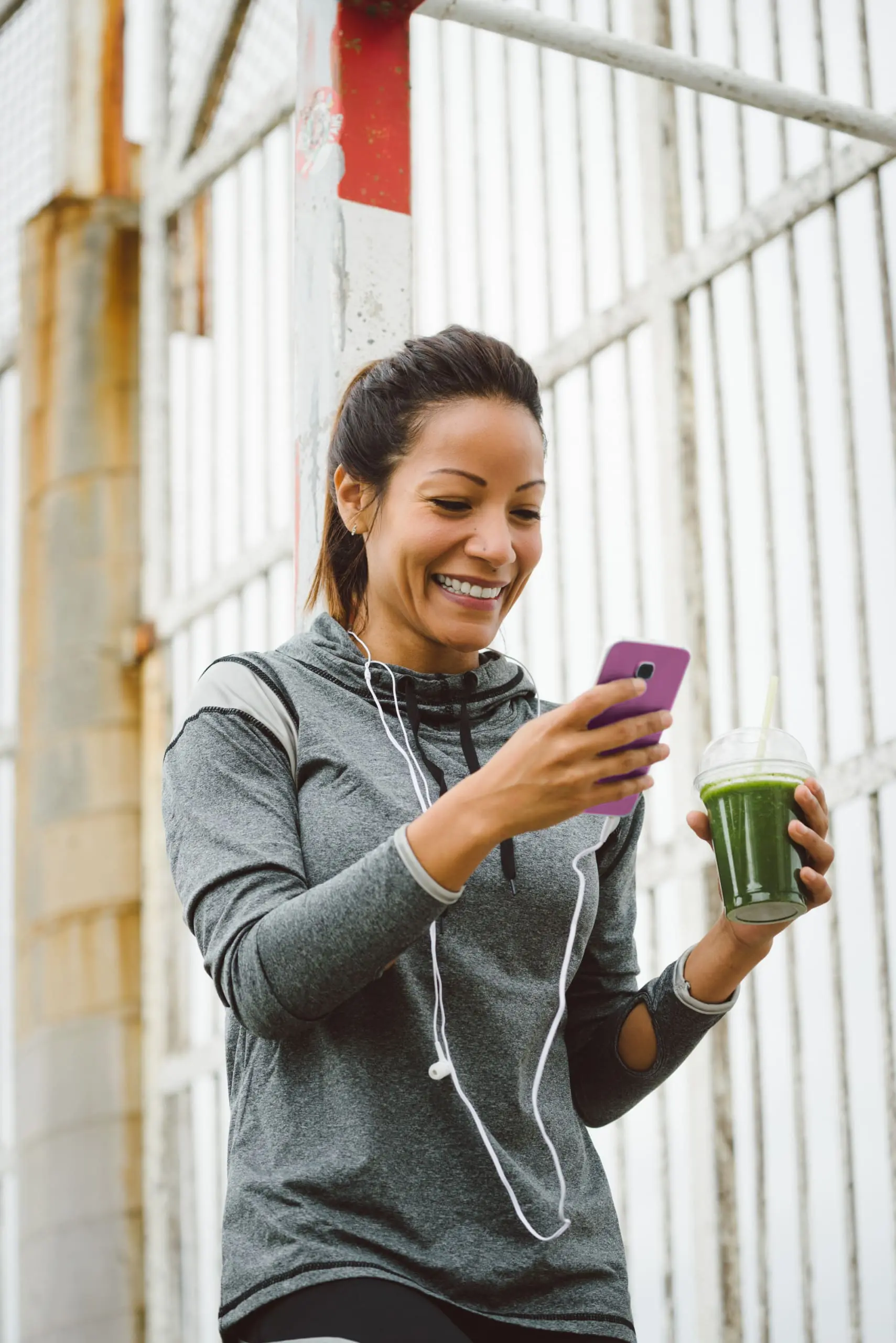 reduce signs of aging and improve your skin, woman drinking Post workout smoothie