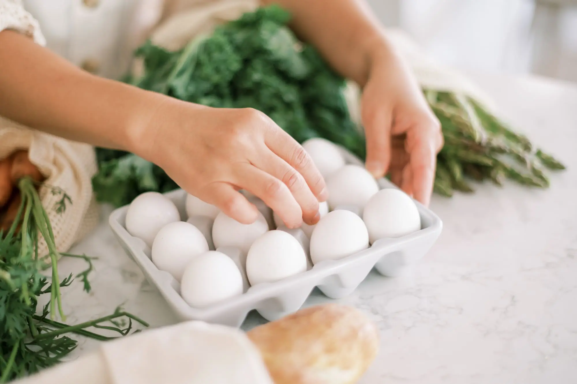 reduce signs of aging and improve your skin, open carton of eggs on marble counter