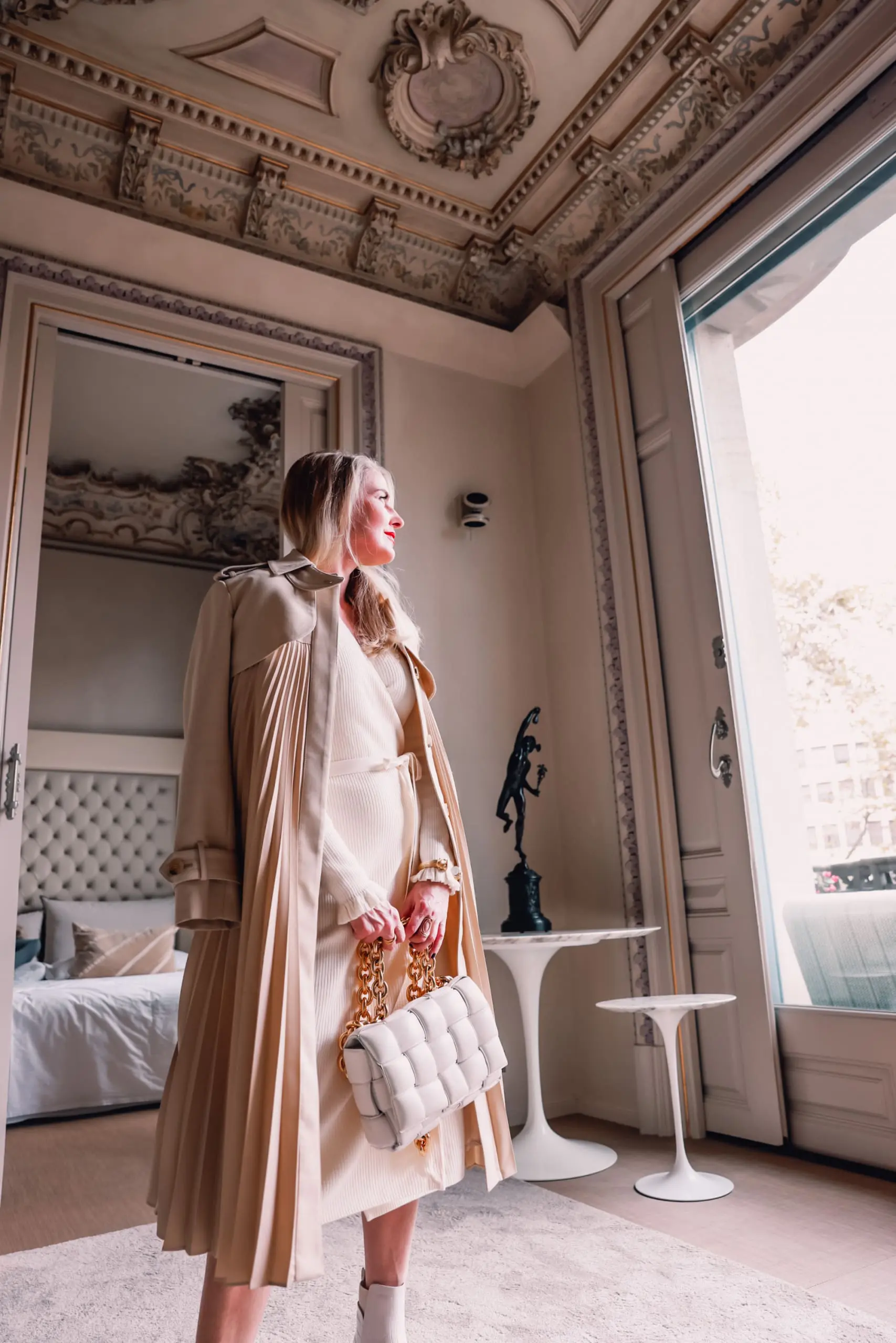 winter neutrals, winter white outfits, winter outfits, neutral outfits, neutral looks, ribbed wrap dress, other stories ribbed wrap midi dress, steve madden wedge chelsea boots, sndro pleated trench coat, erin busbee, el palauet, barcelona, spain