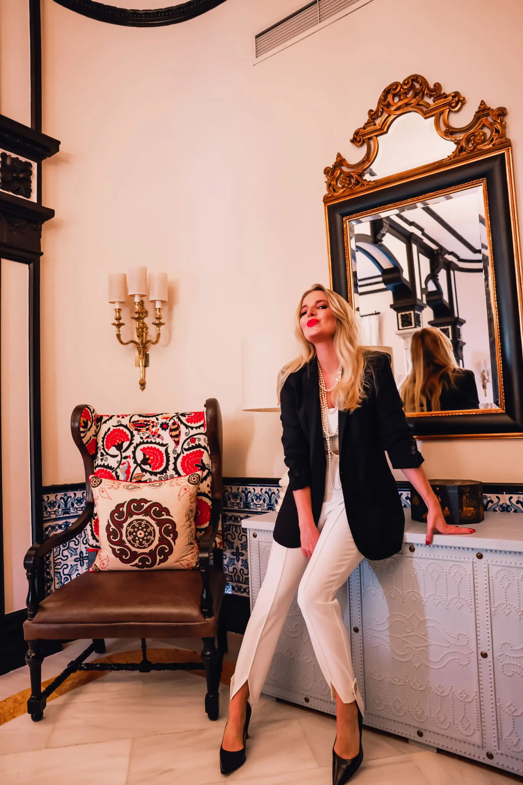 stirrup pants trend, stirrup trend, stirrup pants, stirrup leggings, stirrup tights, stirrup pants 80s, stirrup jeans, elisabetta frnachi white stirrup trousers, black mango boyfriend blazer, white cami, black pointed toe pumps, multi-strand pearl chanel necklace, erin bsubee, sevilla, spain, Hotel Alfonso XIII