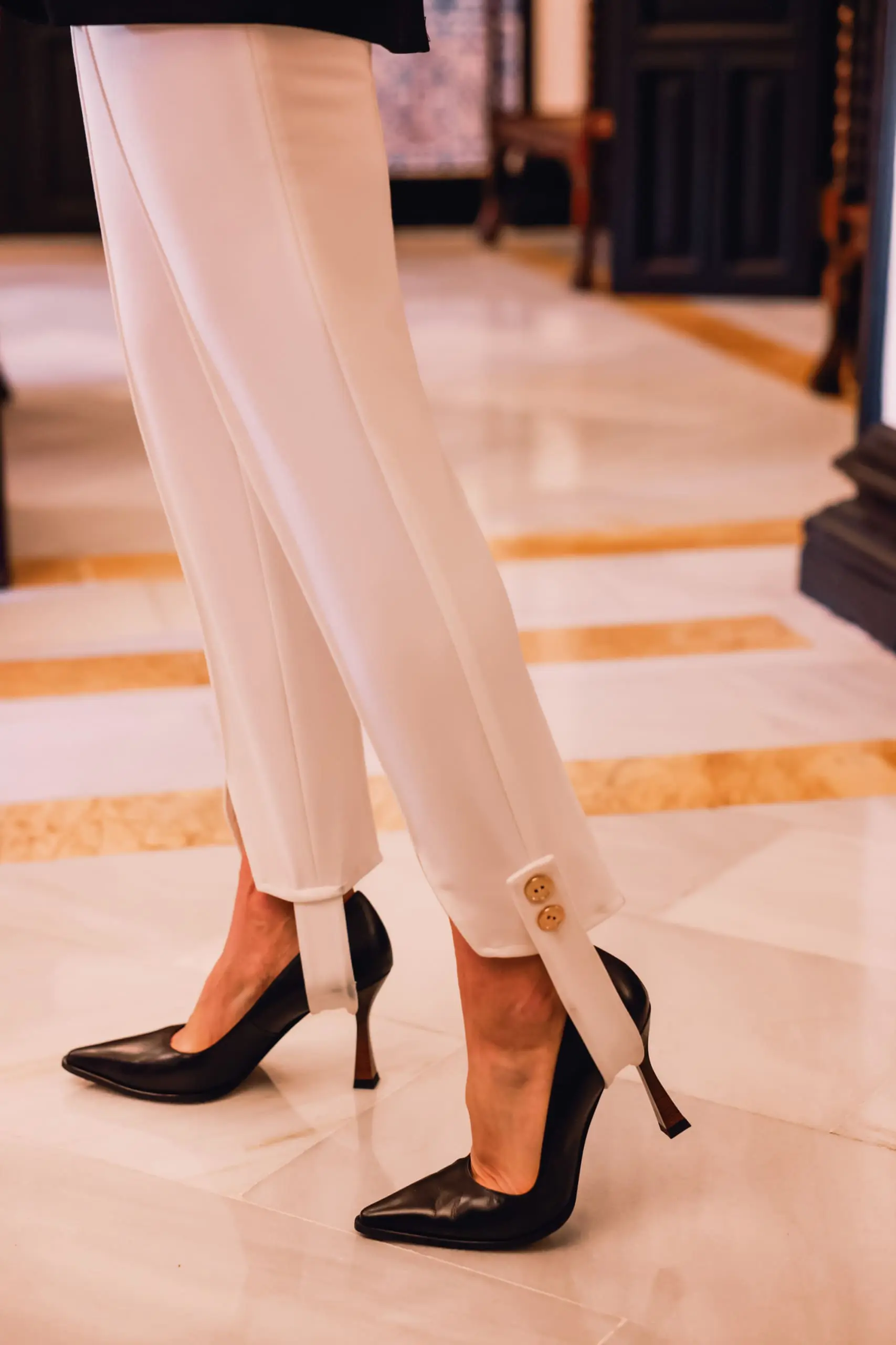 stirrup pants trend, stirrup trend, stirrup pants, stirrup leggings, stirrup tights, stirrup pants 80s, stirrup jeans, elisabetta frnachi white stirrup trousers, black mango boyfriend blazer, white cami, black pointed toe pumps, multi-strand pearl chanel necklace, erin bsubee, sevilla, spain, Hotel Alfonso XIII