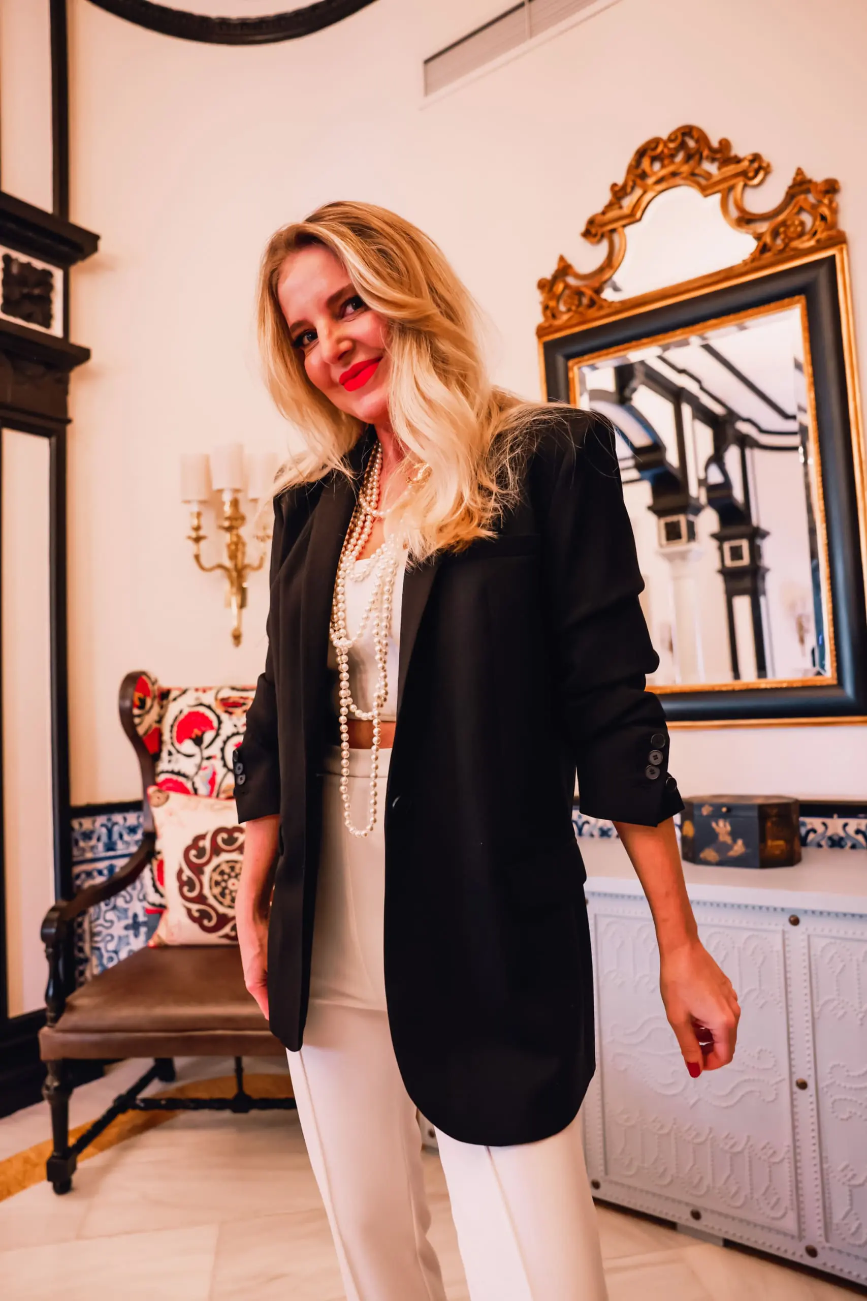 stirrup pants trend, stirrup trend, stirrup pants, stirrup leggings, stirrup tights, stirrup pants 80s, stirrup jeans, elisabetta frnachi white stirrup trousers, black mango boyfriend blazer, white cami, black pointed toe pumps, multi-strand pearl chanel necklace, erin bsubee, sevilla, spain, Hotel Alfonso XIII