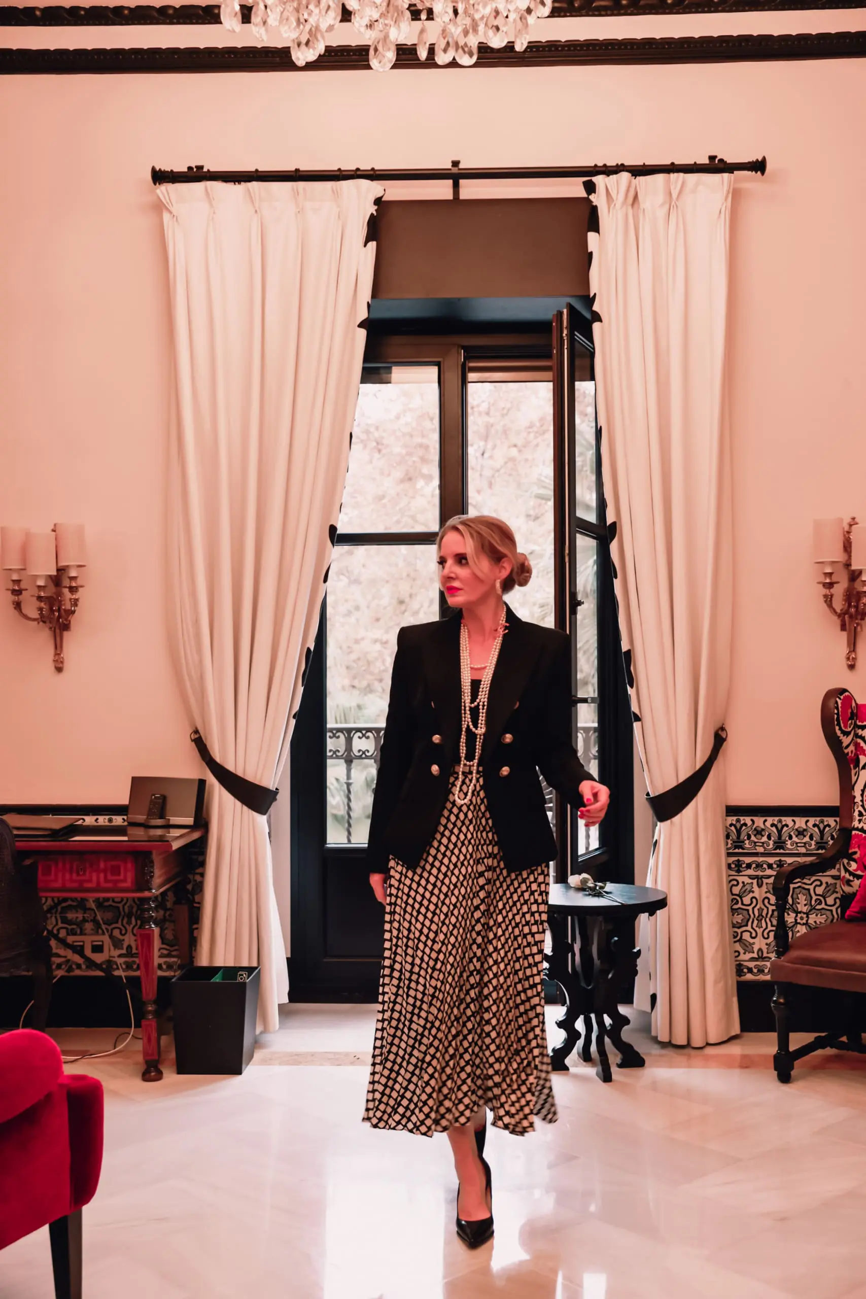 office outfits, stylish office outfits, chic office outfits, office outfits over 40, workwear over 40, stylish workwear, erin busbee, black and white printed mango midi skirt, chanel multi strand necklace, black cami, black pointed toe pumps, sevilla, spain