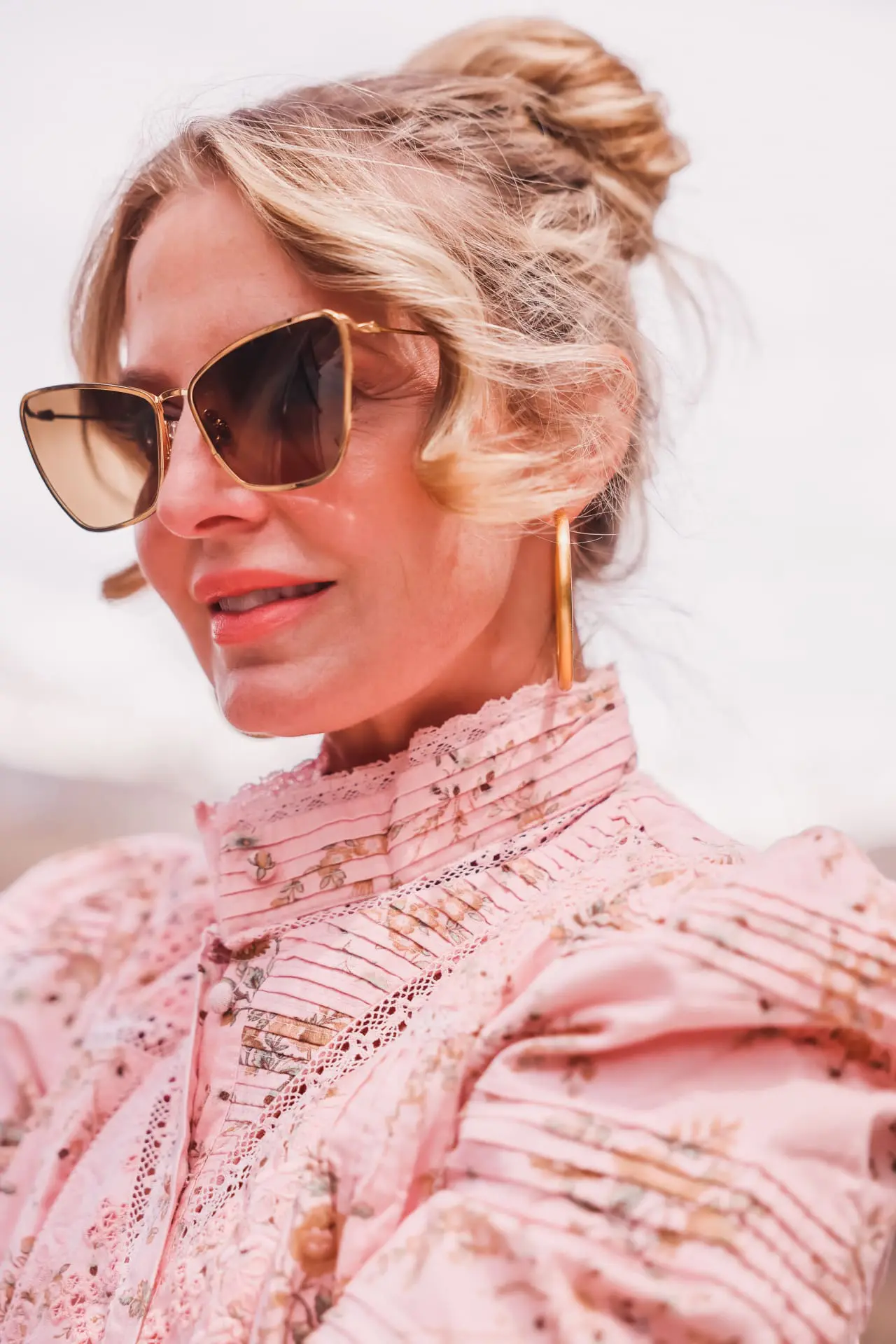 summer self care, summer self care essentials, sun protection, maui jim sunglasses, polarized sunglasses, puakenikeni sunglasses by maui jim, erin busbee, busbee style, telluride, colorado, loveshackfancy pink floral blouse, alice + olivia wide leg jeans, vince camuto booties, dean davidson gold hoops