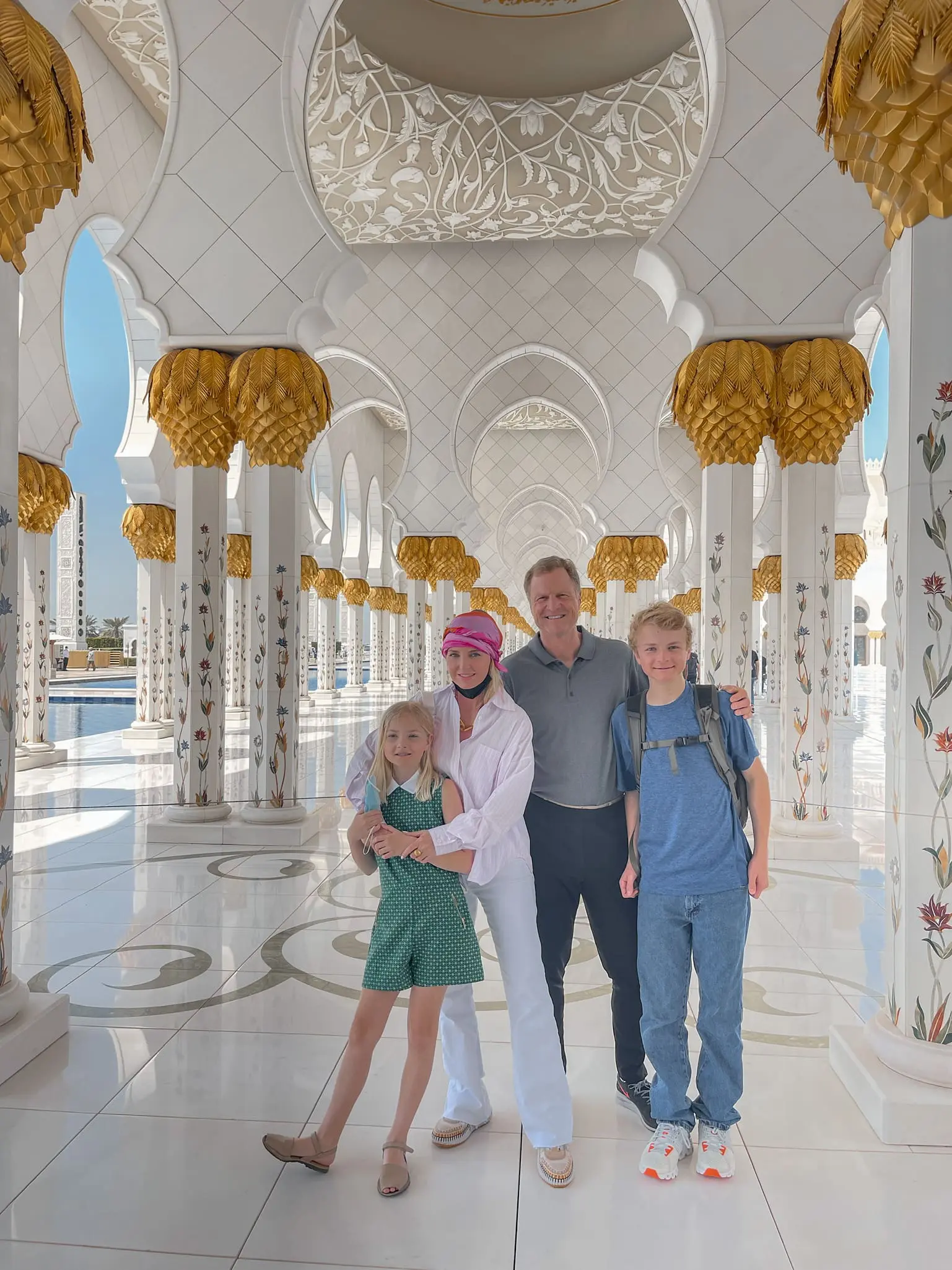 how to dress in middle east, womens dress code in middle east, middle eastern dress female, how to blend in in the middle east, shoes to wear in middle east, what to wear in middle east, how to look stylish in middle east, erin busbee, busbee style, Sheikh Zayed Grand Mosque, Abu Dhabi, what to wear Sheikh Zayed Grand Mosque, zadig & voltaire pink striped shirt, kut from the kloth white wide leg jeans, pink headscarf, chloe sneakers
