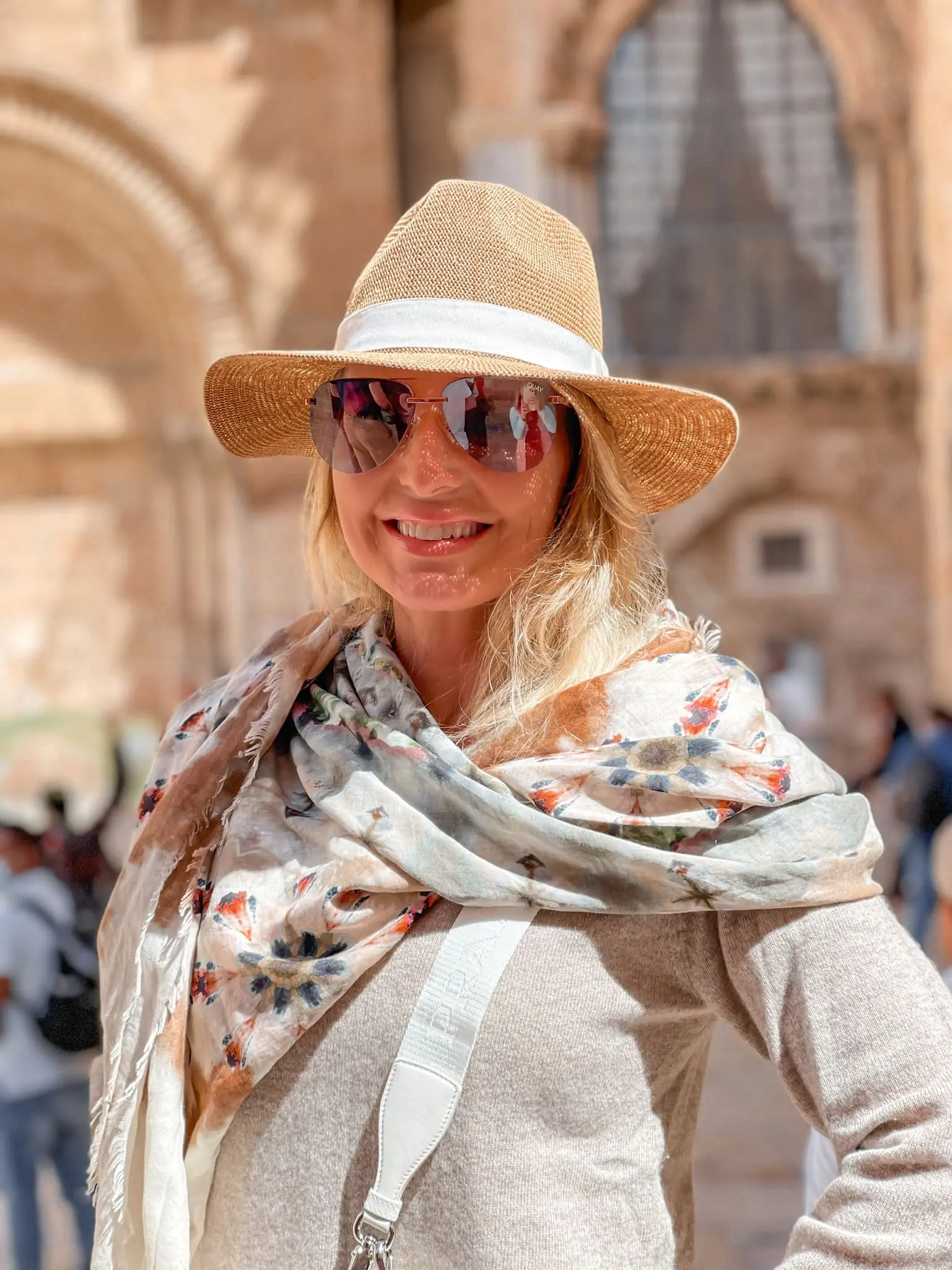 how to dress in middle east, womens dress code in middle east, middle eastern dress female, how to blend in in the middle east, shoes to wear in middle east, what to wear in middle east, how to look stylish in middle east, erin busbee, busbee style, Jerusalem, israel, what to wear in jerusalem, brochu walker lace trim sweater, kut from the kloth white jeans, chloe sneakers, neutral scarf, hariatt isles hat