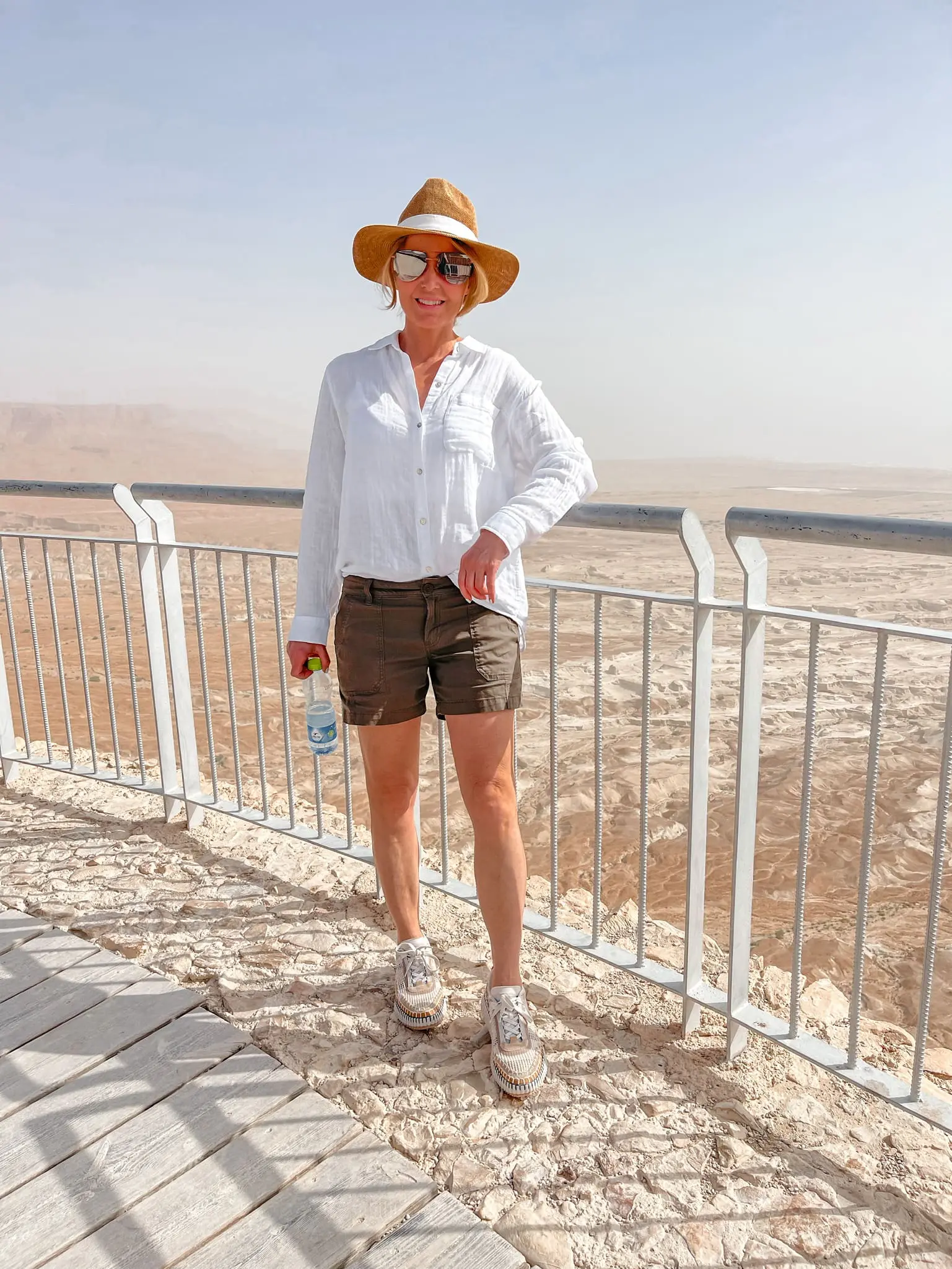how to dress in middle east, womens dress code in middle east, middle eastern dress female, how to blend in in the middle east, shoes to wear in middle east, what to wear in middle east, how to look stylish in middle east, erin busbee, busbee style, hiking masada, hiking in west bank, rails cotton ellis shirt, backcountry green shorts, quay aviator sunglasses, hariatt isles hat, chloe sneakers
