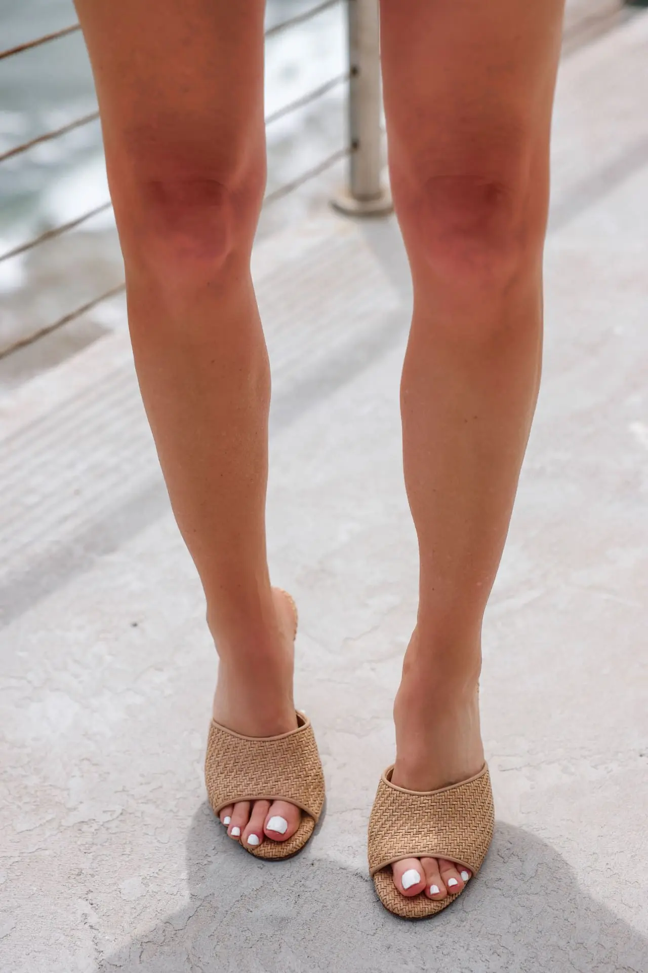 how to wear shorts over 40, best shorts for women over 40, how to wear shorts over 50, flattering shorts for women over 40, best shorts for 40 year old woman, best denim shorts over 40, too old to wear shorts, how to find the perfect shorts, what to wear with shorts, erin busbee, busbee style, malibu, california, brown jonathan simkhai vegan leather shirts, white rails cotton button down shirt, veronica beard woven sandals, saint laurent sunglasses