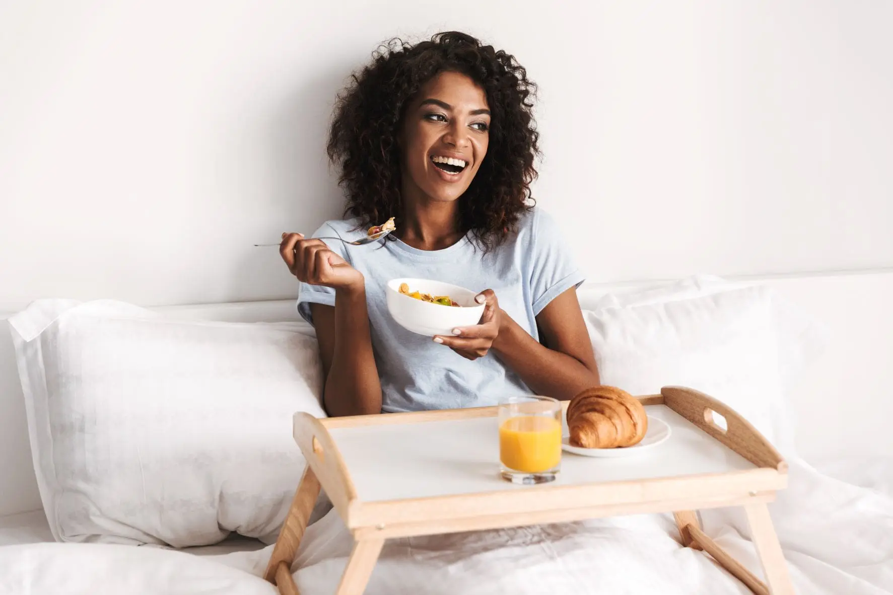 common wellness myths, wellness myths, incorrect wellness tips, bad wellness tips, woman eating in bed