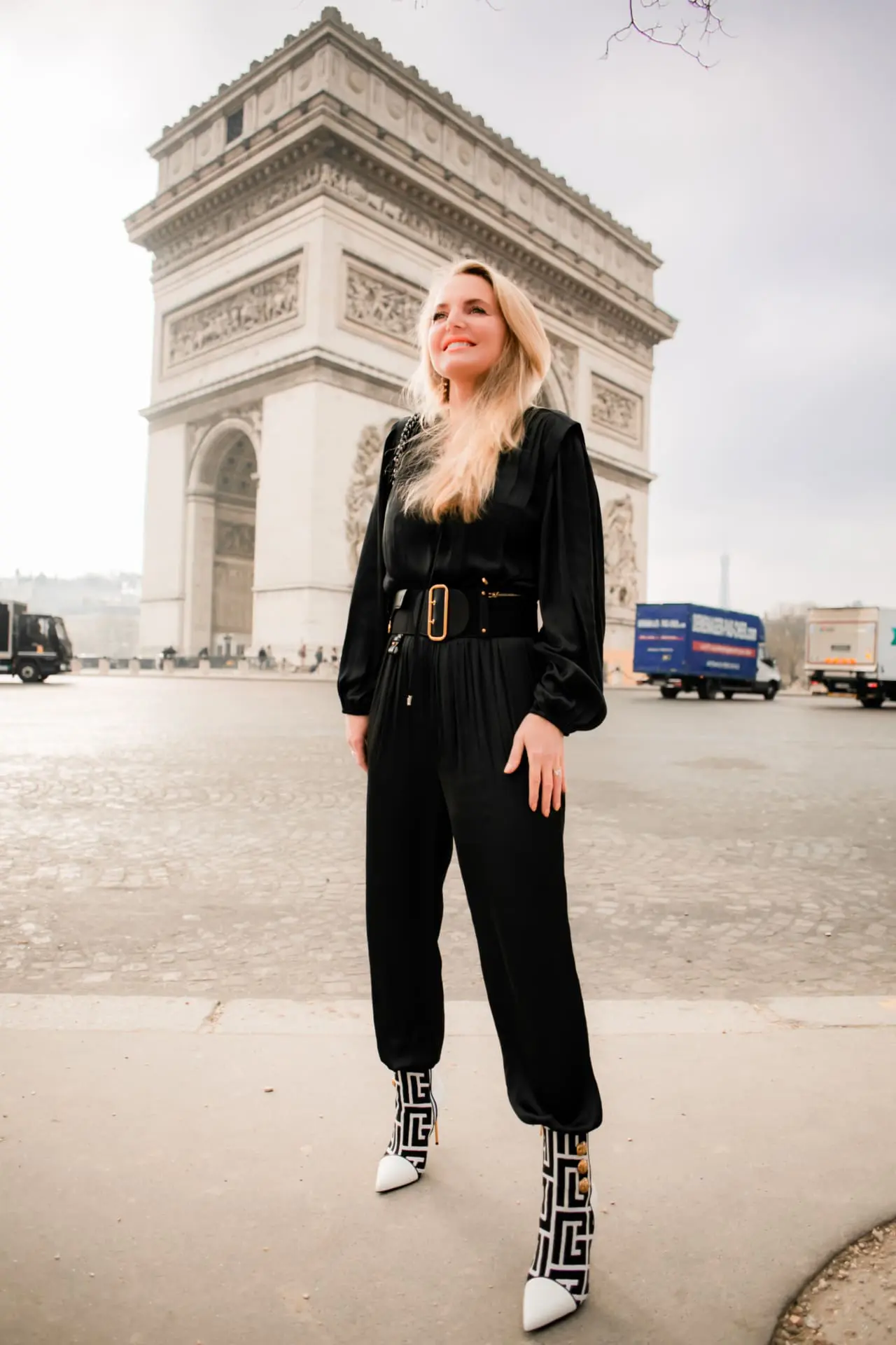 black maje jumpsuit, white and black balmain booties, dior belt