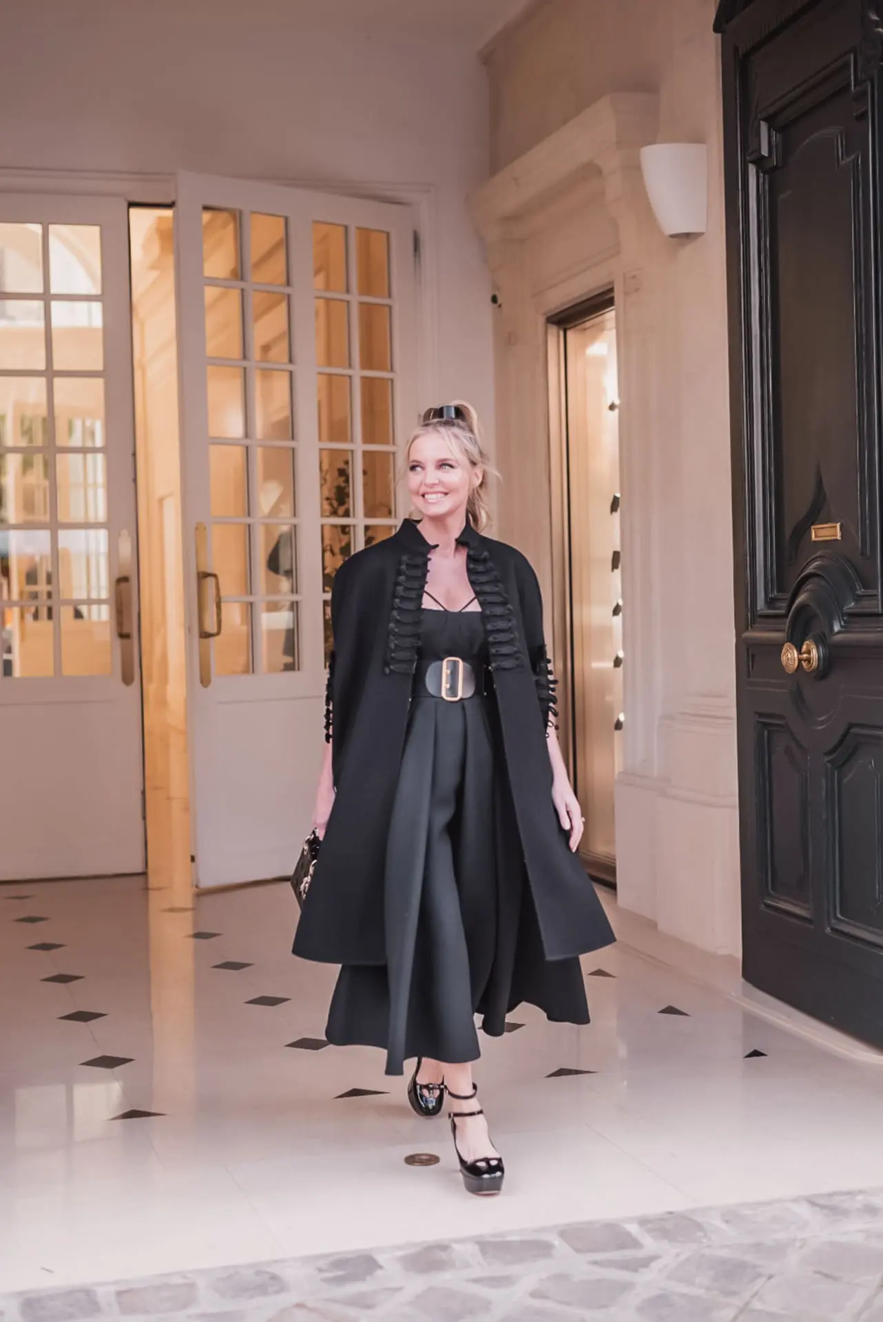 Erin Busbee of busbee style outside Dior store in paris on 30 montaigne