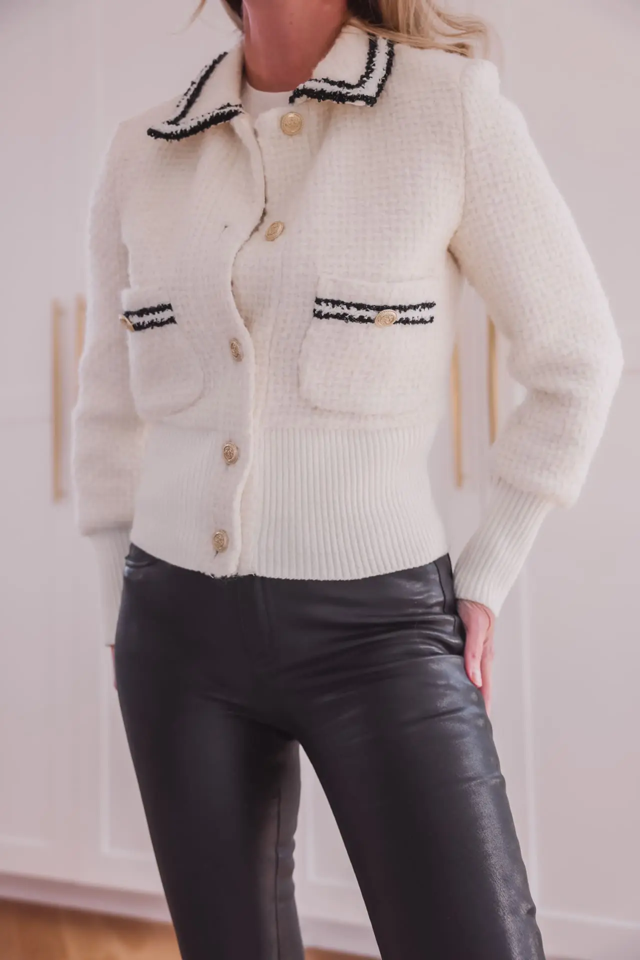 white maje cardigan, black frame leather pants