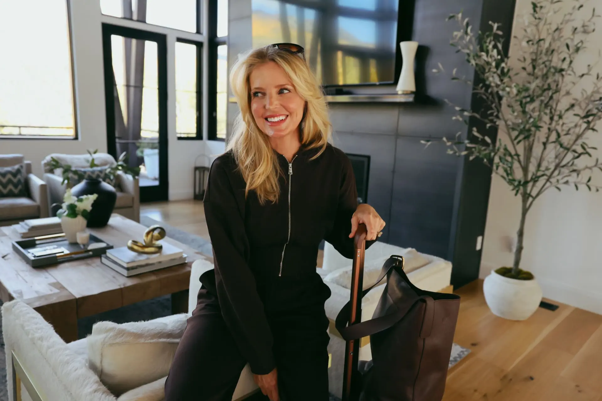 Erin Busbee wearing Lilysilk SILKERRY espresso brown matching set for a cozy travel day outfit
