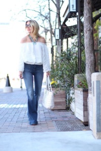 White off shoulder top by gracia, flared jeans by jbrand and a squash blossom necklace