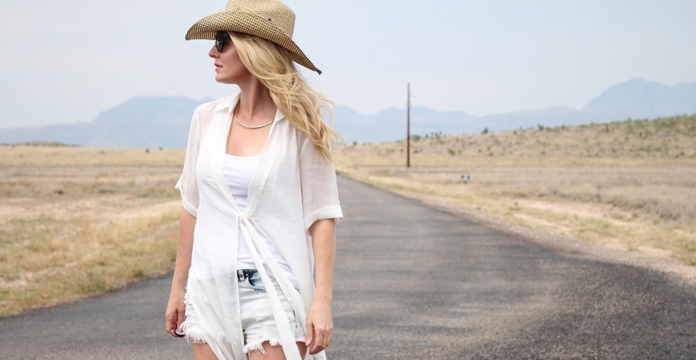 maxi shirt, denim cutoff shorts by BLANK NYC, cowboy hat and white tank with brown buckle moto boots