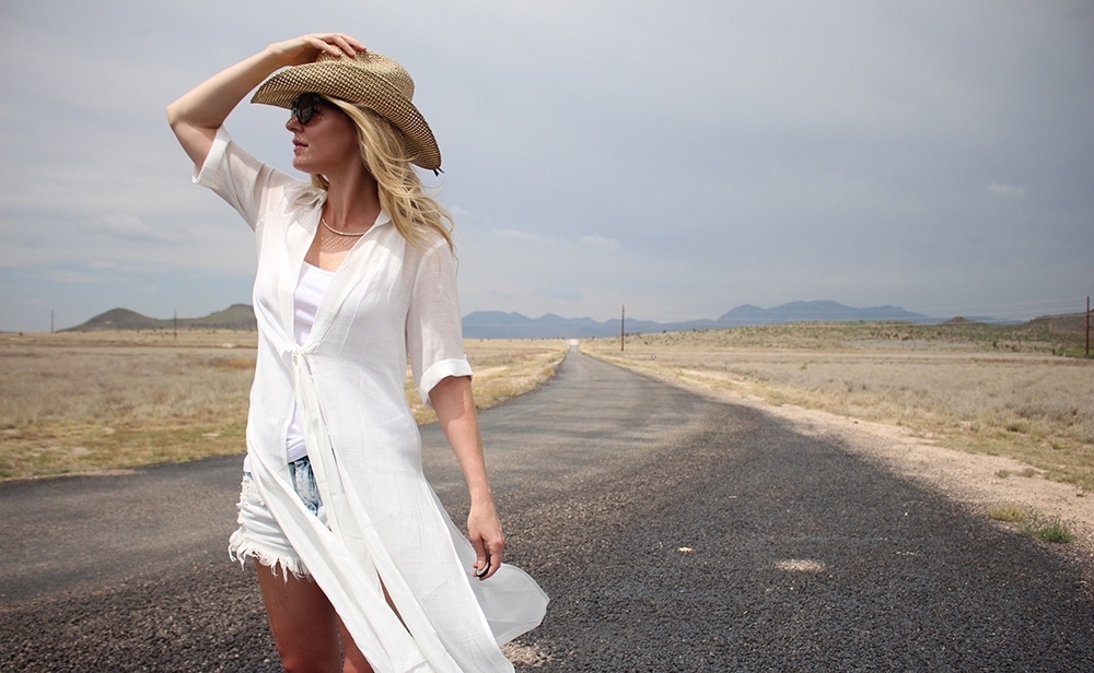 maxi shirt from Asos, denim cutoff shorts by BLANK NYC, cowboy hat and white tank with brown buckle moto boots