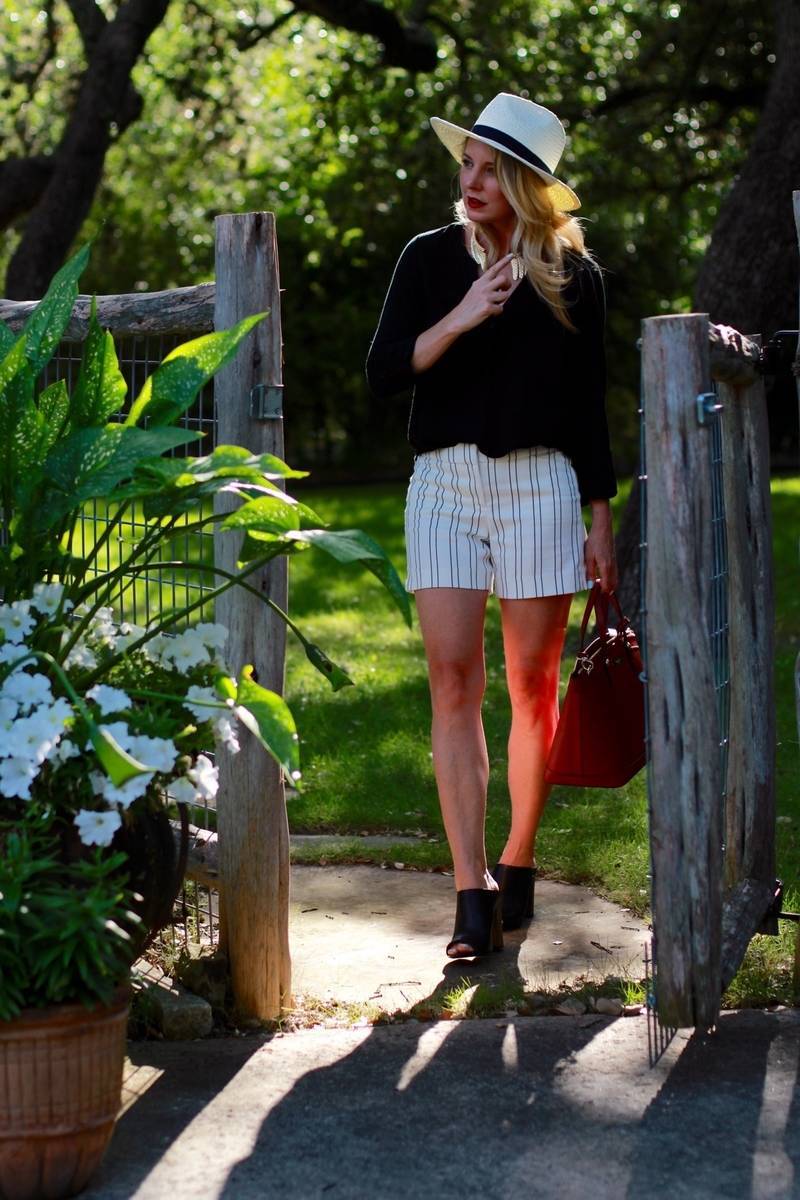 striped shorts with black top and panama hat, with black mules