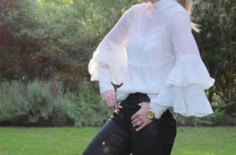 Olivia Palermo, victorian blouse, lace top, high neck blouse, black jeans