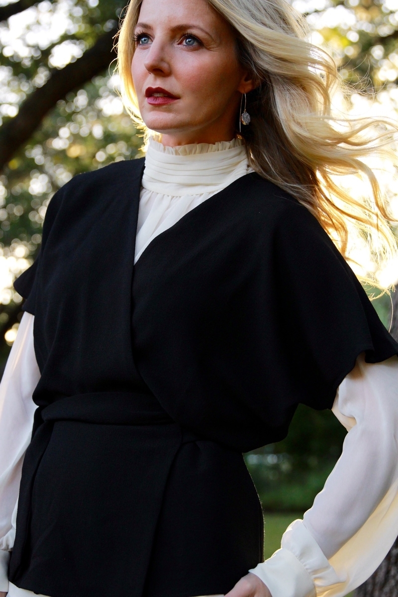 victorian chiffon white blouse layered under a black kimono sleeve, belted top