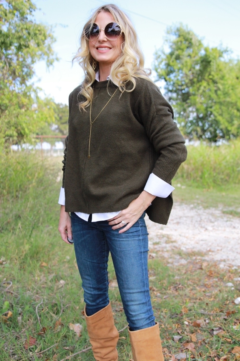 erin busbee smiling with dark green olive sweater by topshop layered over non-iron white button down shirt and skinny jeans with sam edelman knee high boots