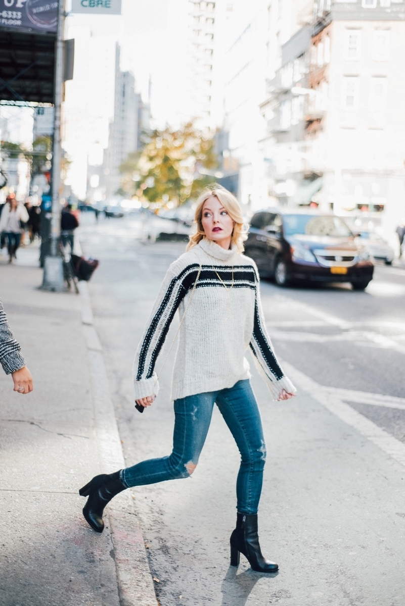 crossing street in new york city wearing citizen rocket jeans and gorjana necklace 